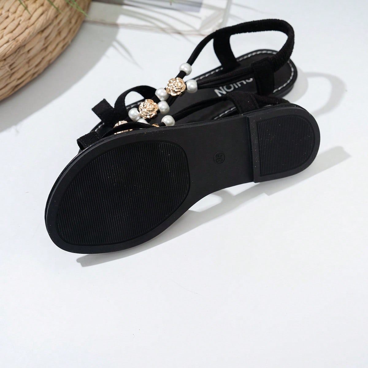 Women's beaded open-toe thong flat sandals in slip-on style for outdoor and beach casual wear.