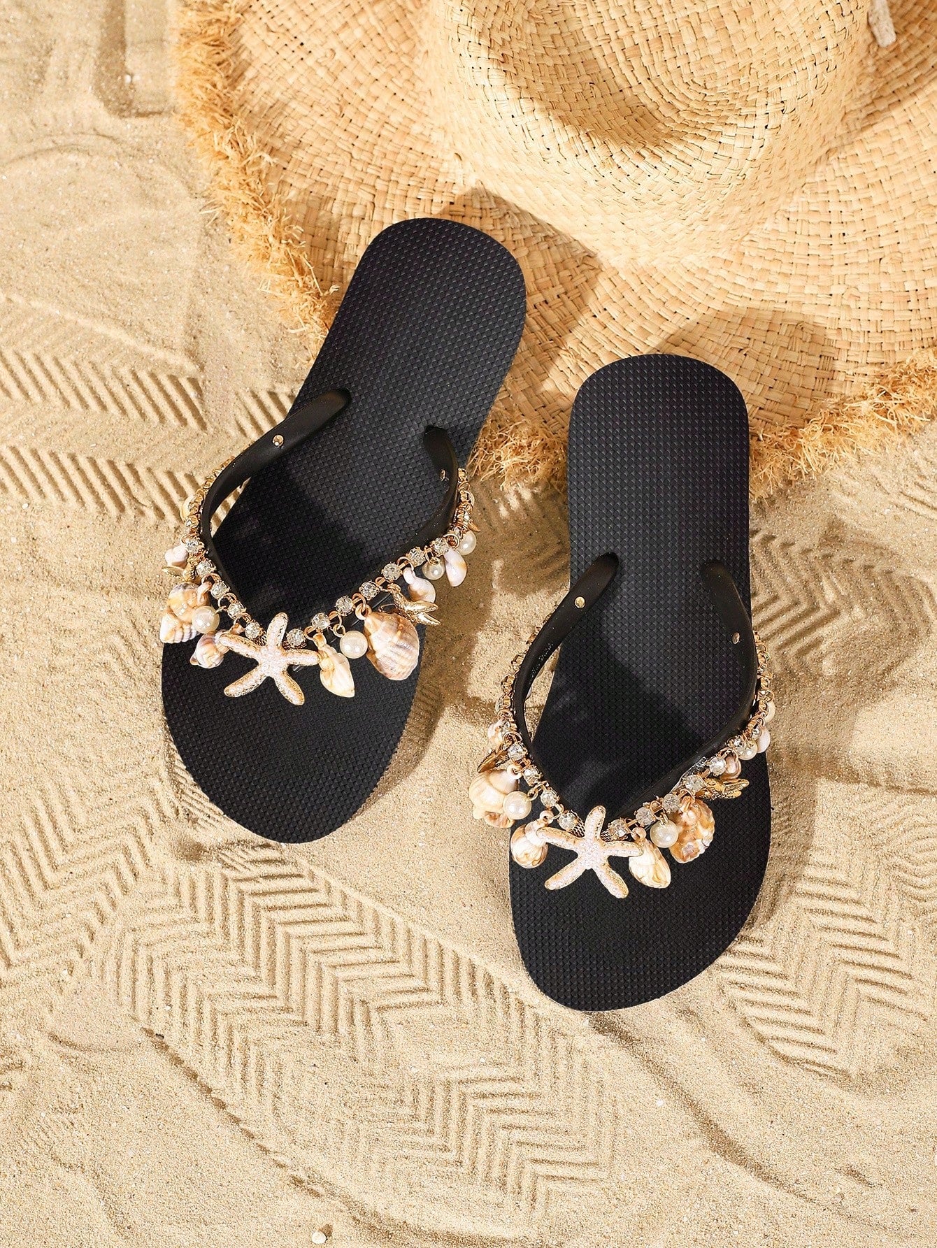 Women’s fashion flip flops with thong strap, beaded shell chain decoration, and removable decor chain detail, designed with a soft flat sole for beach and vacation use.