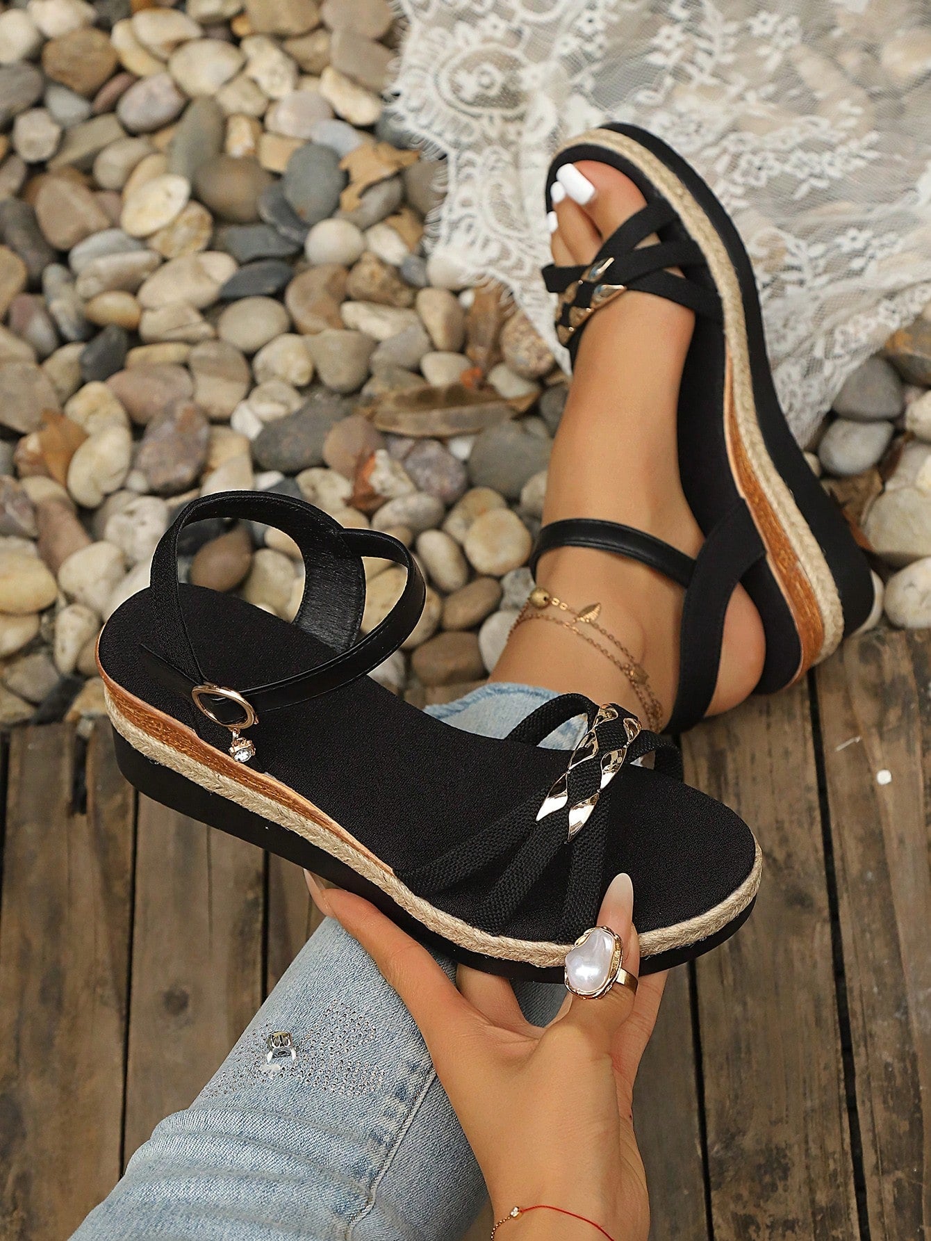 Women’s open-toe wedge sandals with a woven platform-style sole, ankle buckle strap, and mid heel, shown in a casual outdoor style.