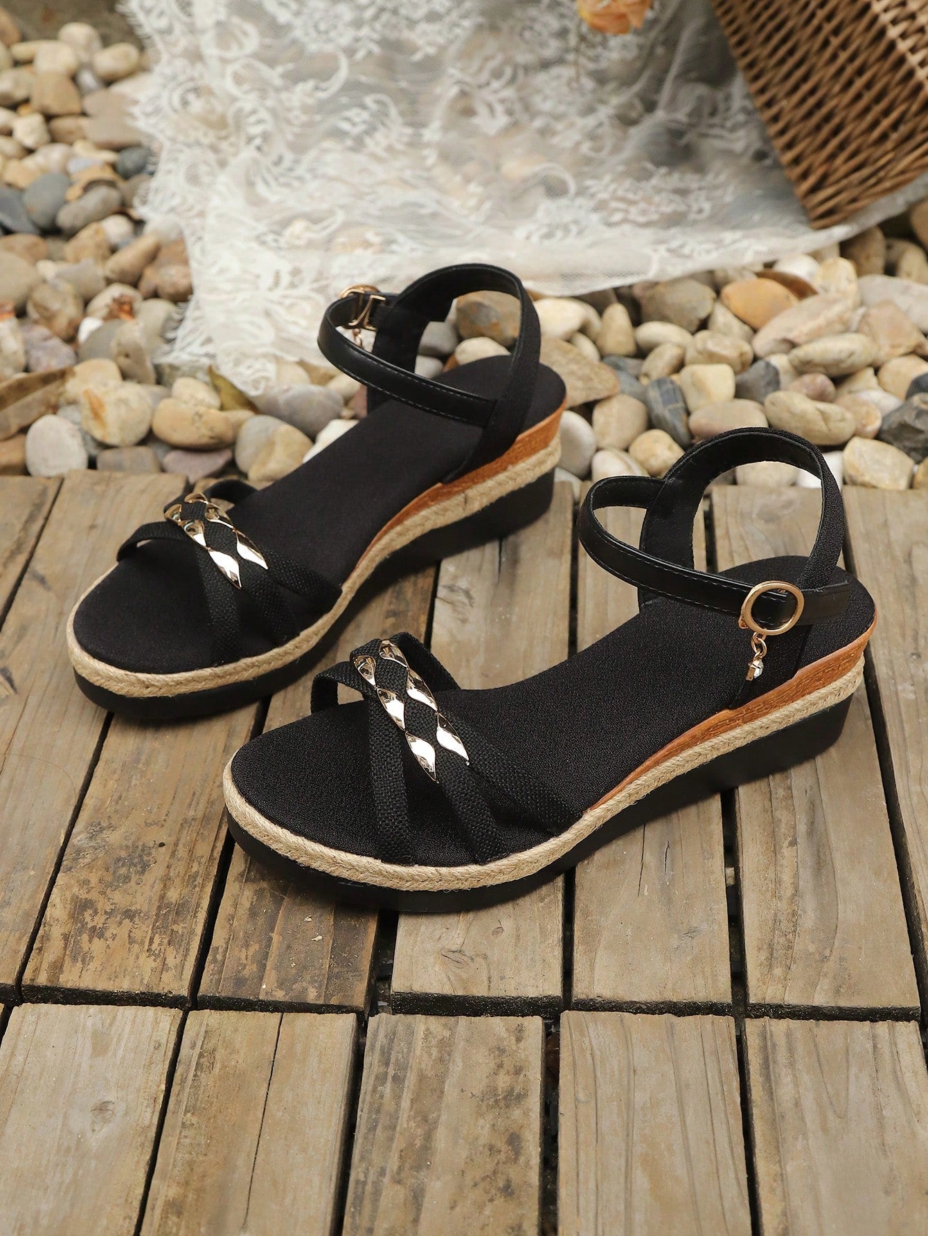 Women’s open-toe wedge sandals with a woven platform-style sole, ankle buckle strap, and mid heel, shown in a casual outdoor style.