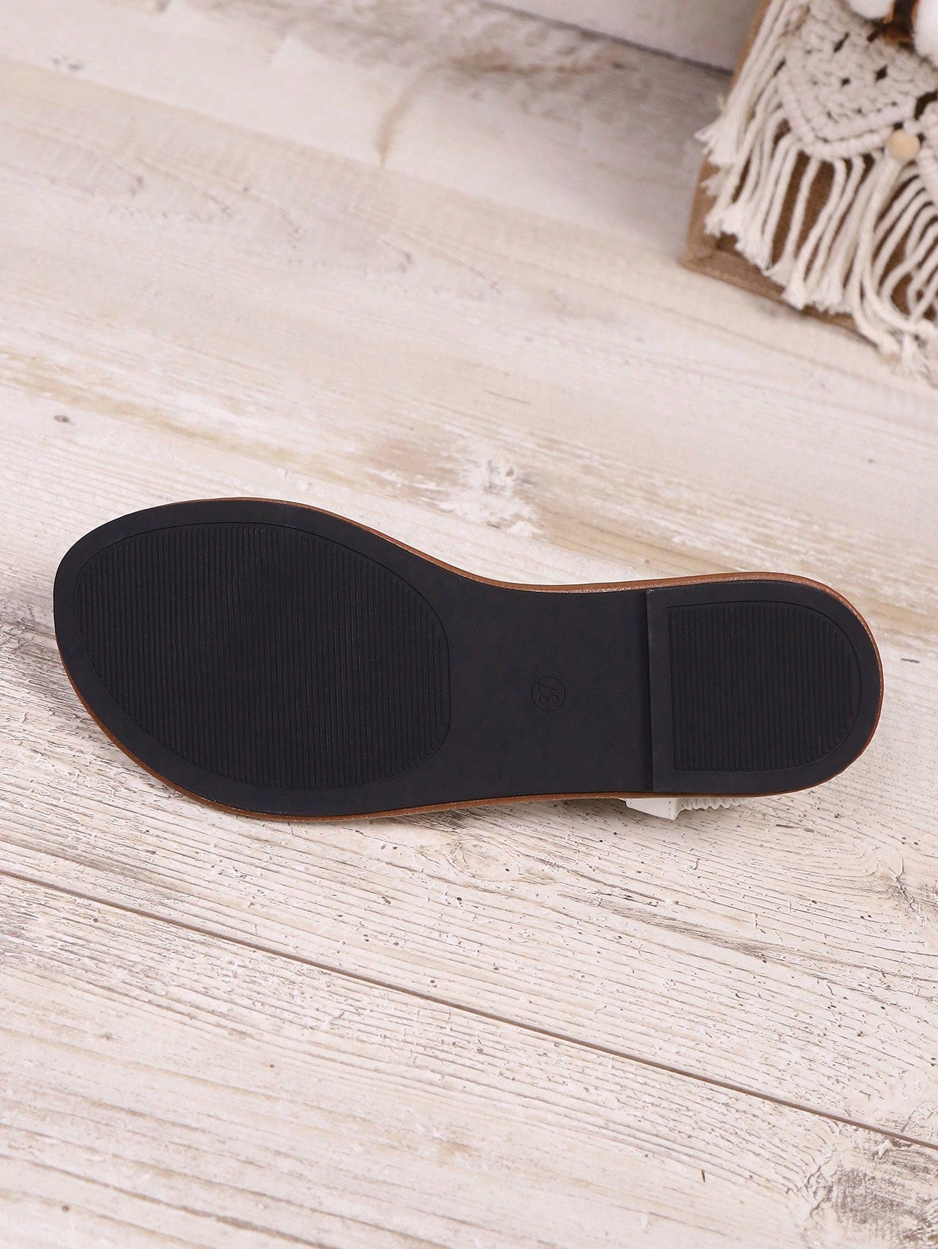 Open-toe flat slide sandals featuring rhinestone leaf decoration in a vacation-inspired style.