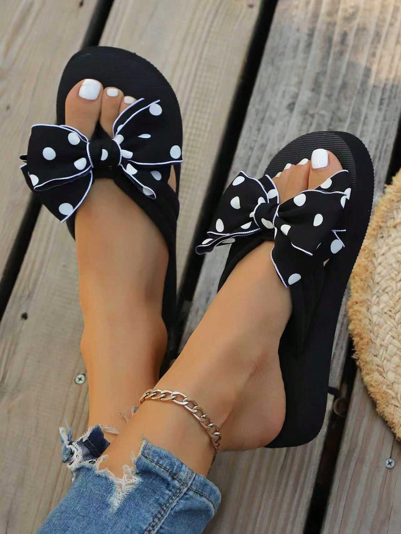 Srendia women's flip flops with polka dot bow detail, flat non-slip sole, and fabric upper for beach, vacation, home, and outdoor wear.