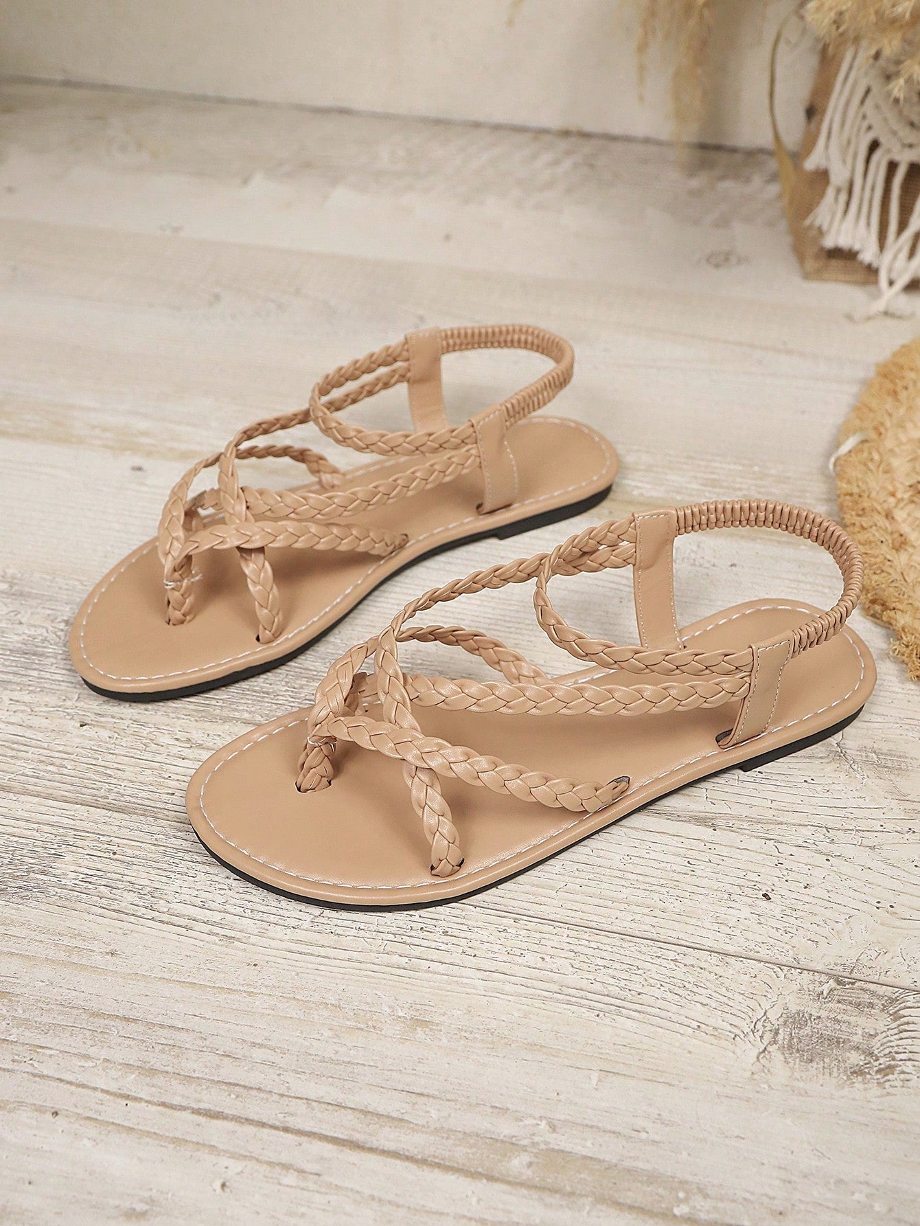 Open-toe flat slide sandals featuring rhinestone leaf decoration in a vacation-inspired style.