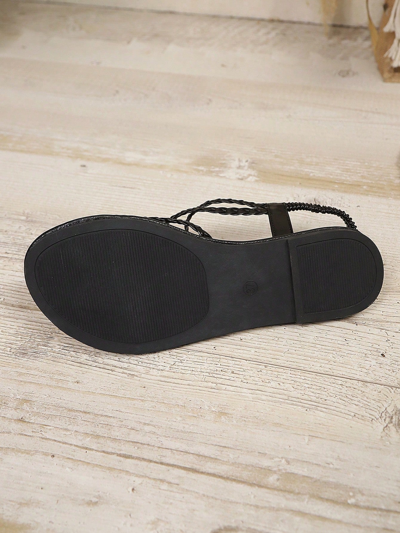 Open-toe flat slide sandals featuring rhinestone leaf decoration in a vacation-inspired style.