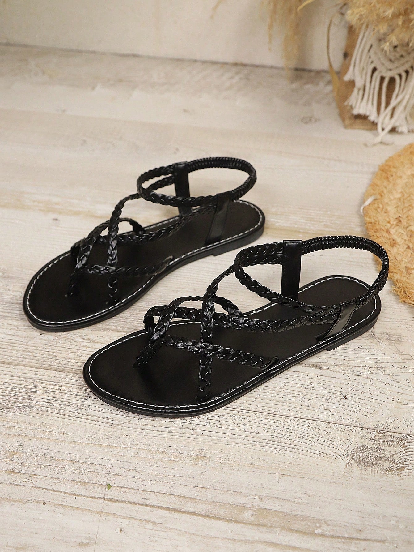 Open-toe flat slide sandals featuring rhinestone leaf decoration in a vacation-inspired style.