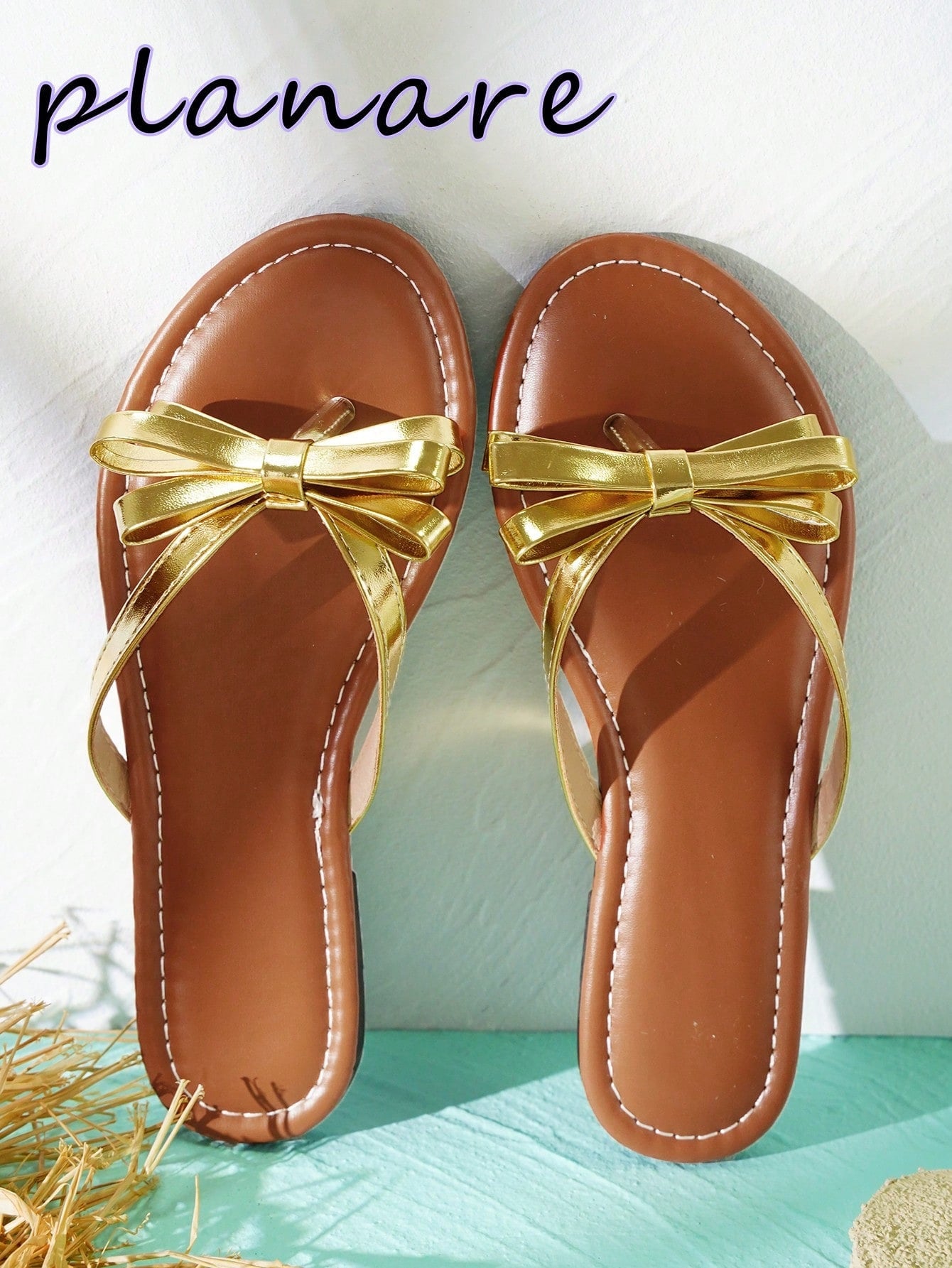 Women’s flat slide sandals with contrast mesh bow decoration and textured upper, open toe design, and slip-on style for beach and vacation wear.