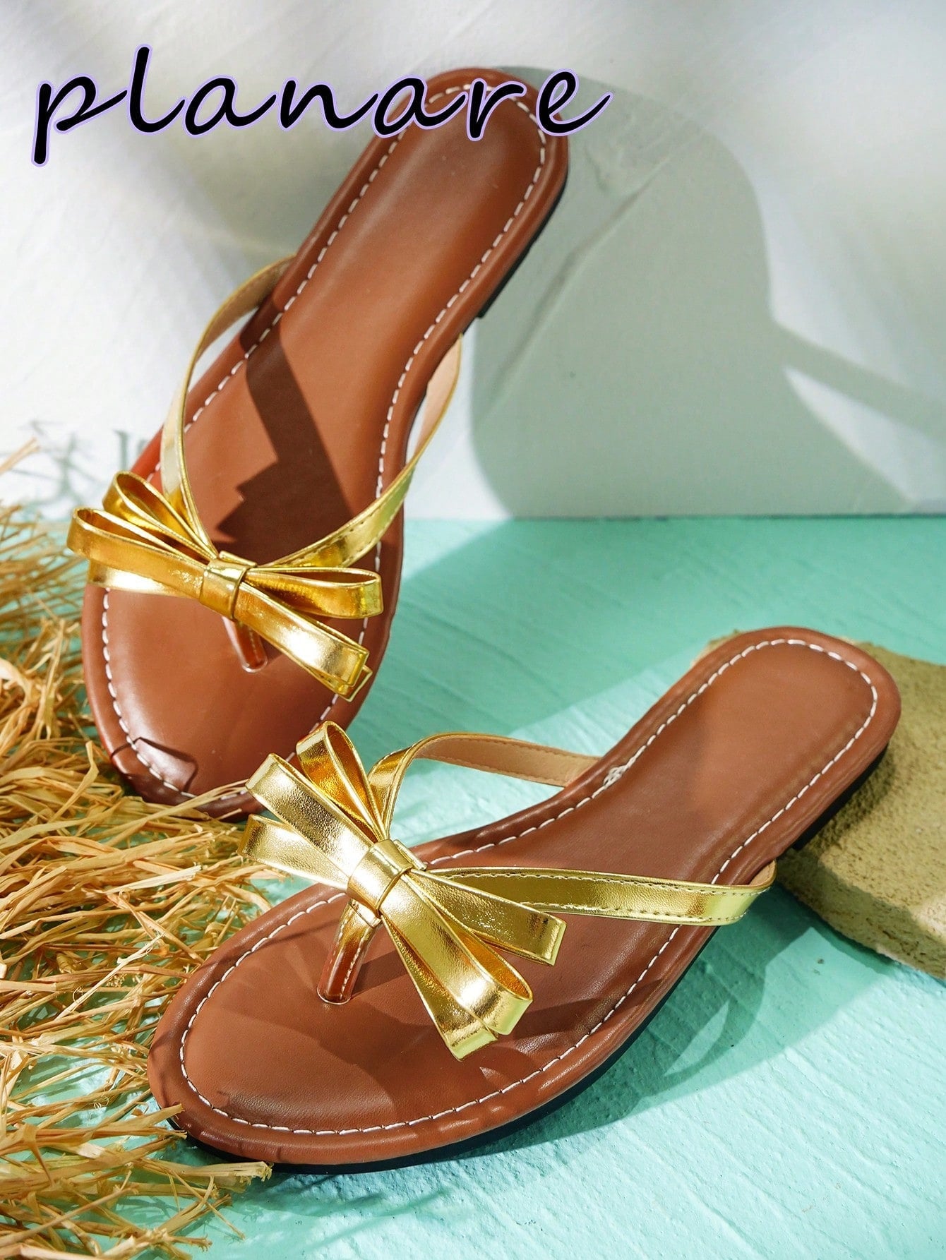 Women’s flat slide sandals with contrast mesh bow decoration and textured upper, open toe design, and slip-on style for beach and vacation wear.