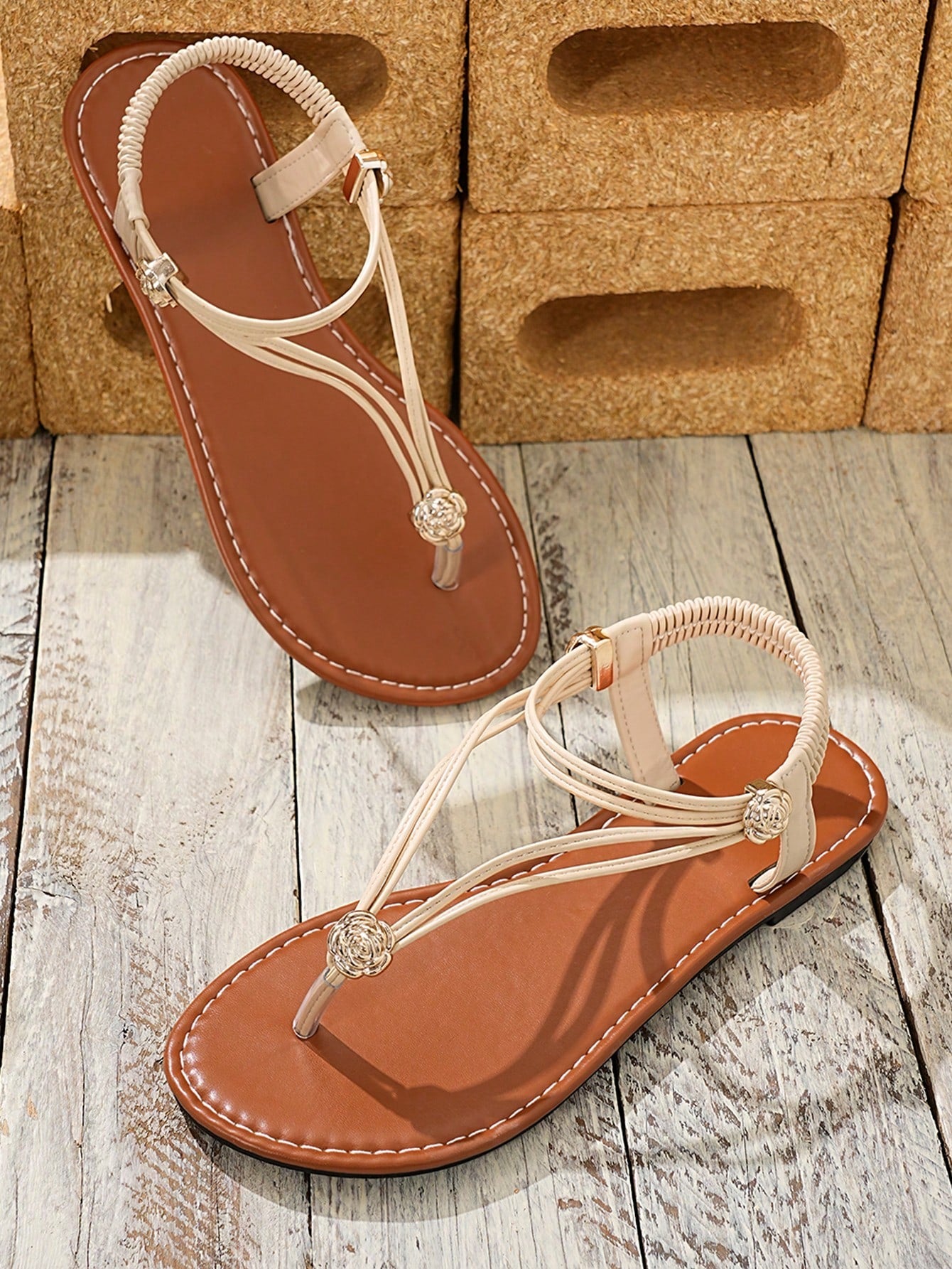 Women's bohemian flat thong sandals with toe-post design and rhinestone detail, slip-on style with PU leather upper and rubber sole.