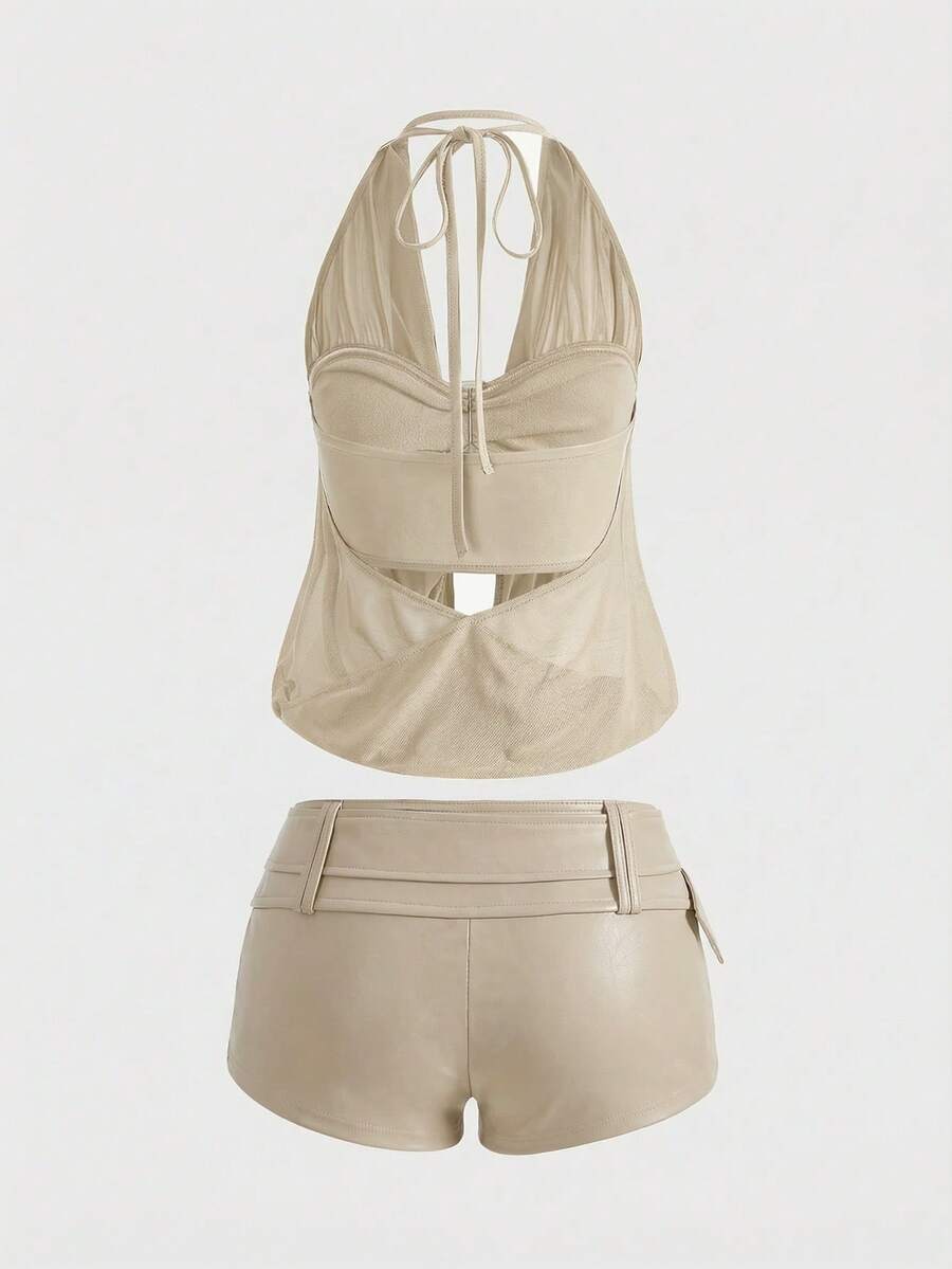 Women's Gyaru-style two-piece outfit with a draped halter crop top, backless tie detail, and mini bodycon shorts