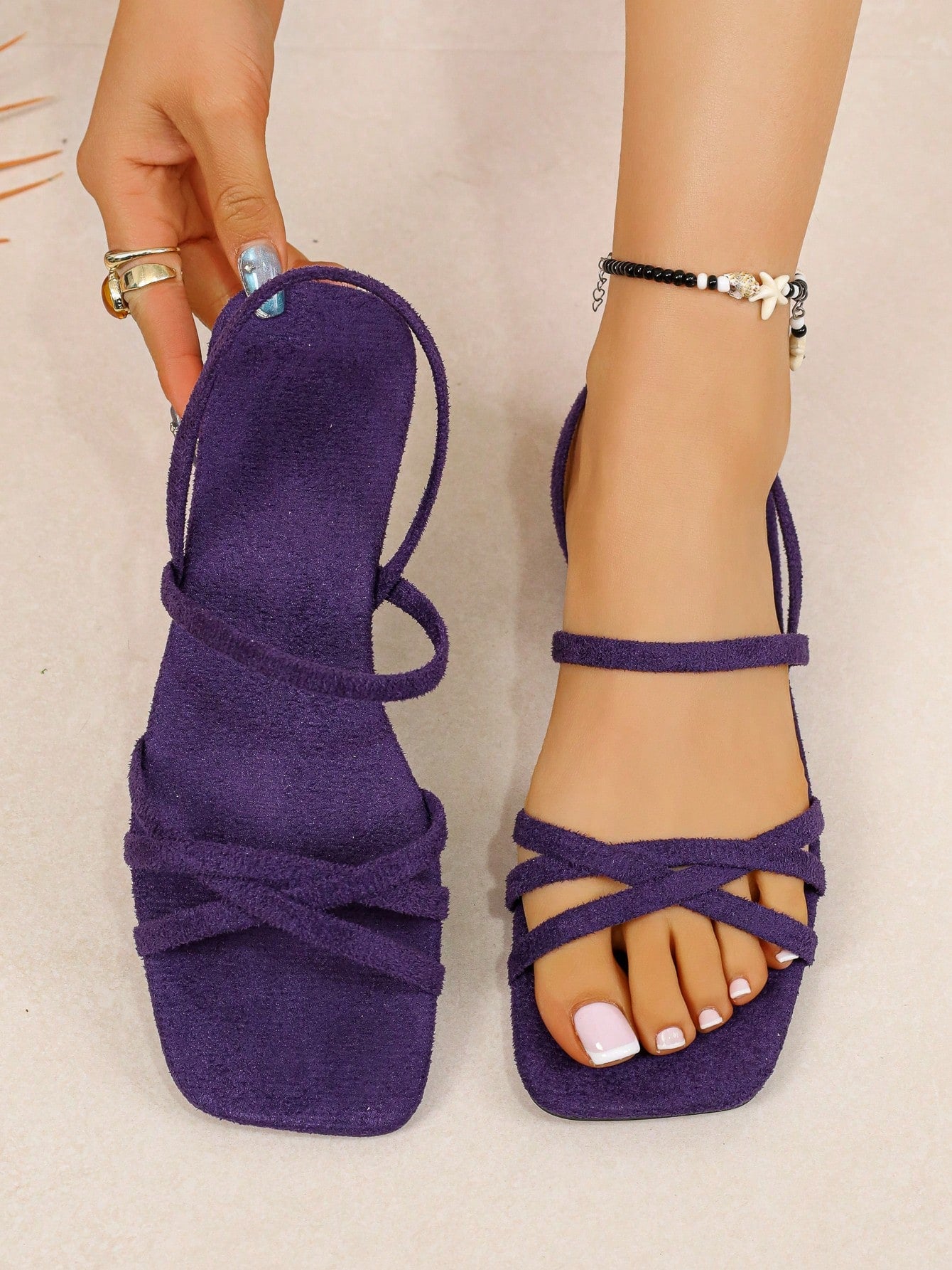 Women's flat sandals with a square open toe, crisscross front straps, and an elastic ankle strap, suitable for casual summer outdoor and beach vacation wear.