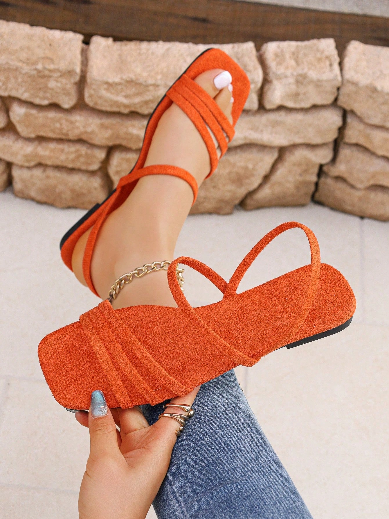 Women's flat sandals with a square open toe, crisscross front straps, and an elastic ankle strap, suitable for casual summer outdoor and beach vacation wear.