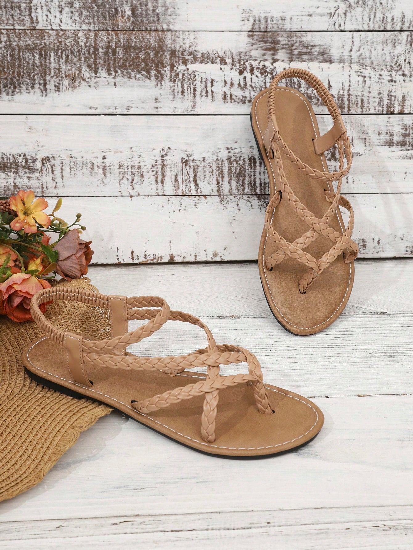 Women's woven criss-cross elastic flat sandals with braided strappy upper and toe post design