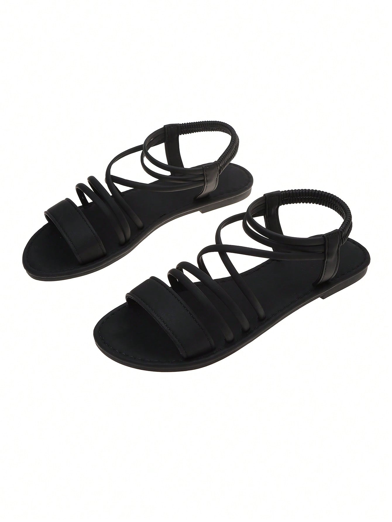 Women's flat open-toe sandals with thin criss-cross straps and a classic casual beach style.