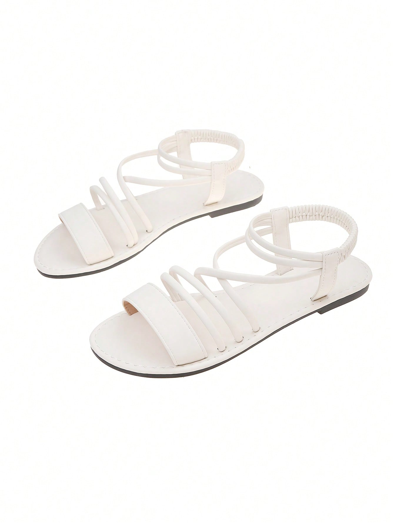 Women's flat open-toe sandals with thin criss-cross straps and a classic casual beach style.