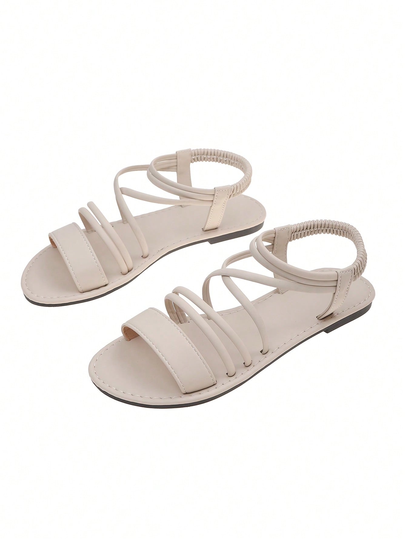 Women's flat open-toe sandals with thin criss-cross straps and a classic casual beach style.
