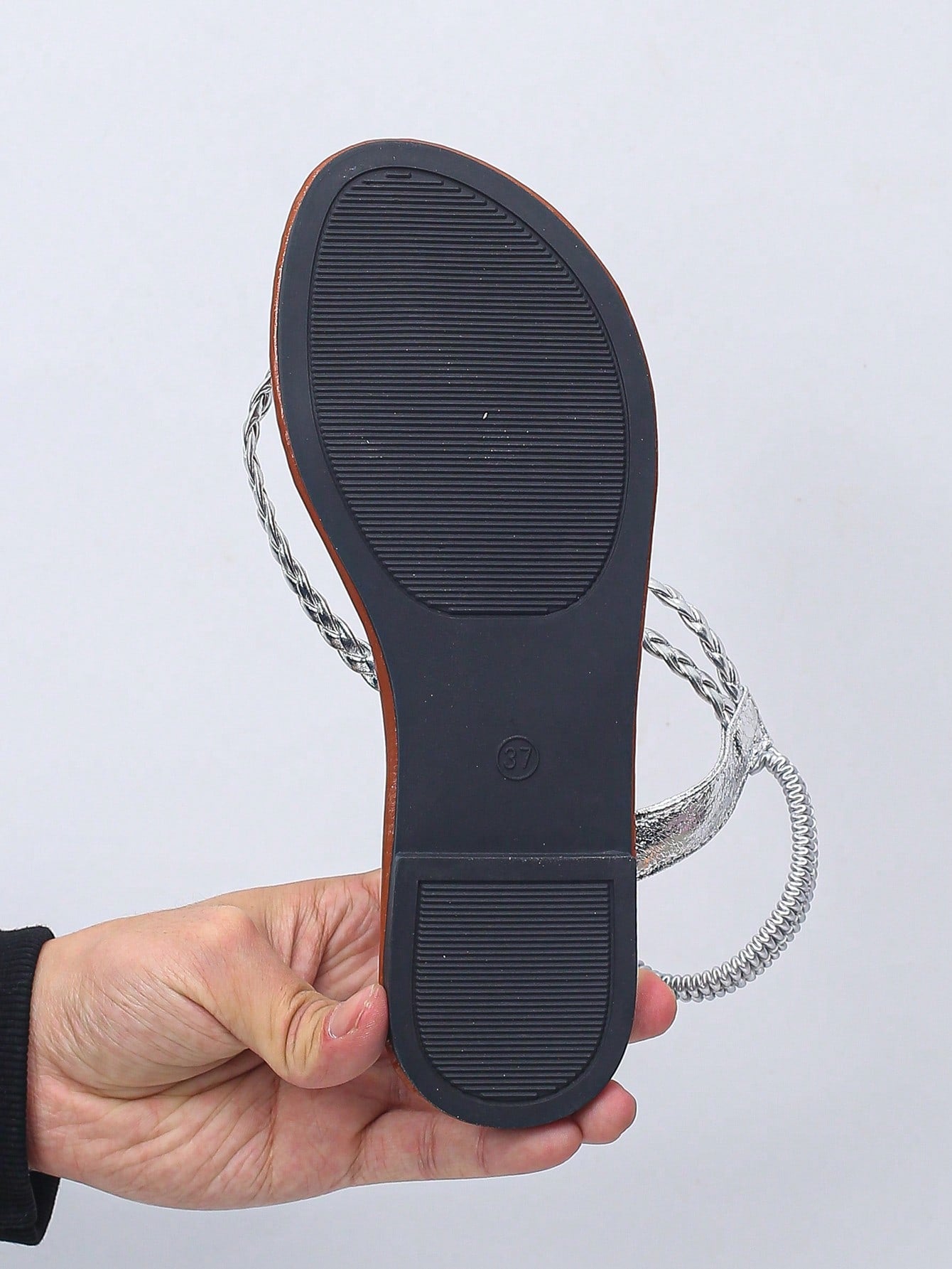 Women’s plus size 35-45 flat thong sandals with elastic strap, round toe shape, textured pattern, and rhinestone asymmetrical detail in slip-on beach style for outdoor summer wear.