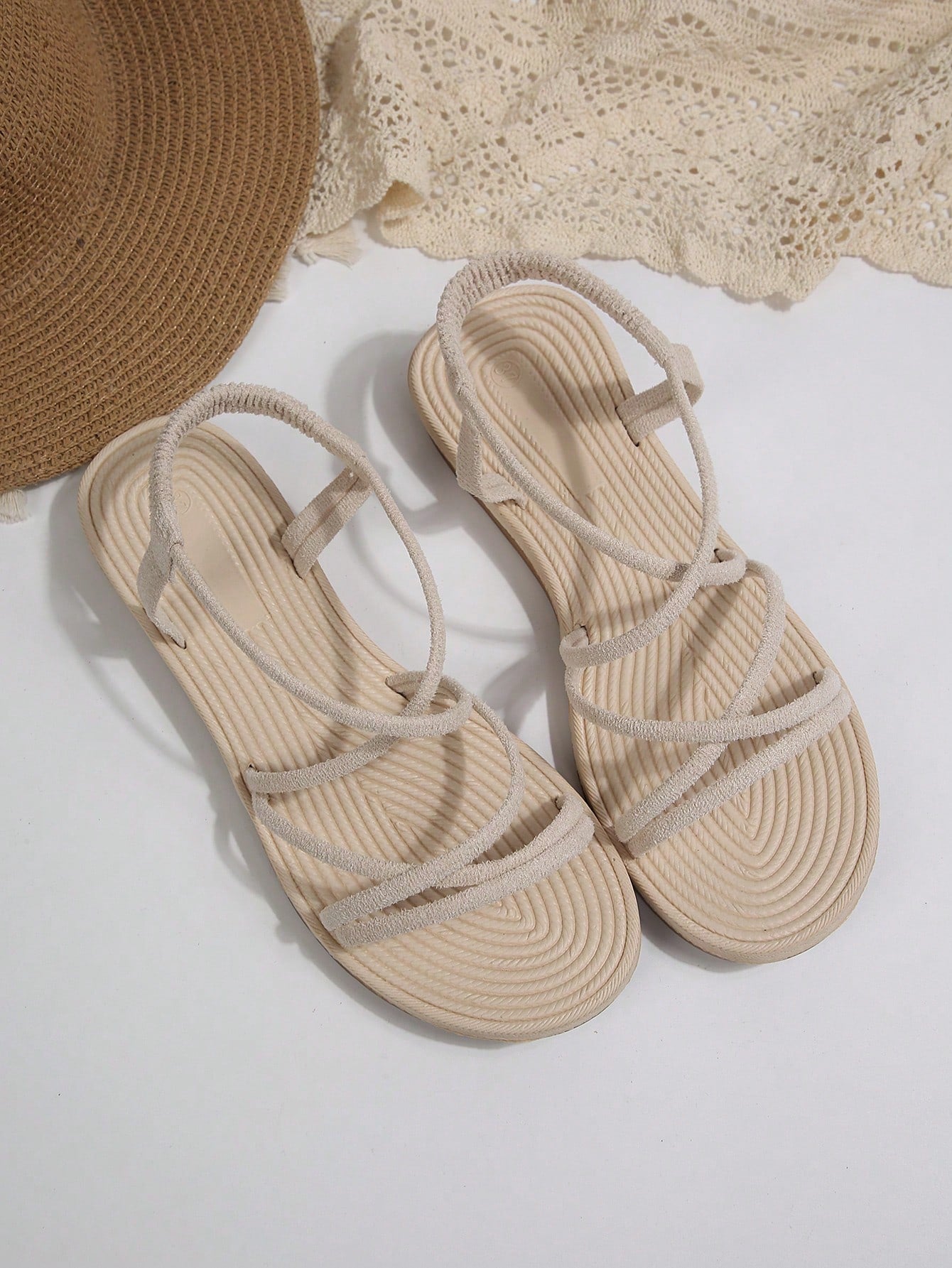 Beige ultra comfy water slide sandals for women and girls with open toe, elastic strap, flat heel, and thick sole, suitable for beach, swimming, hiking, sports, and travel.