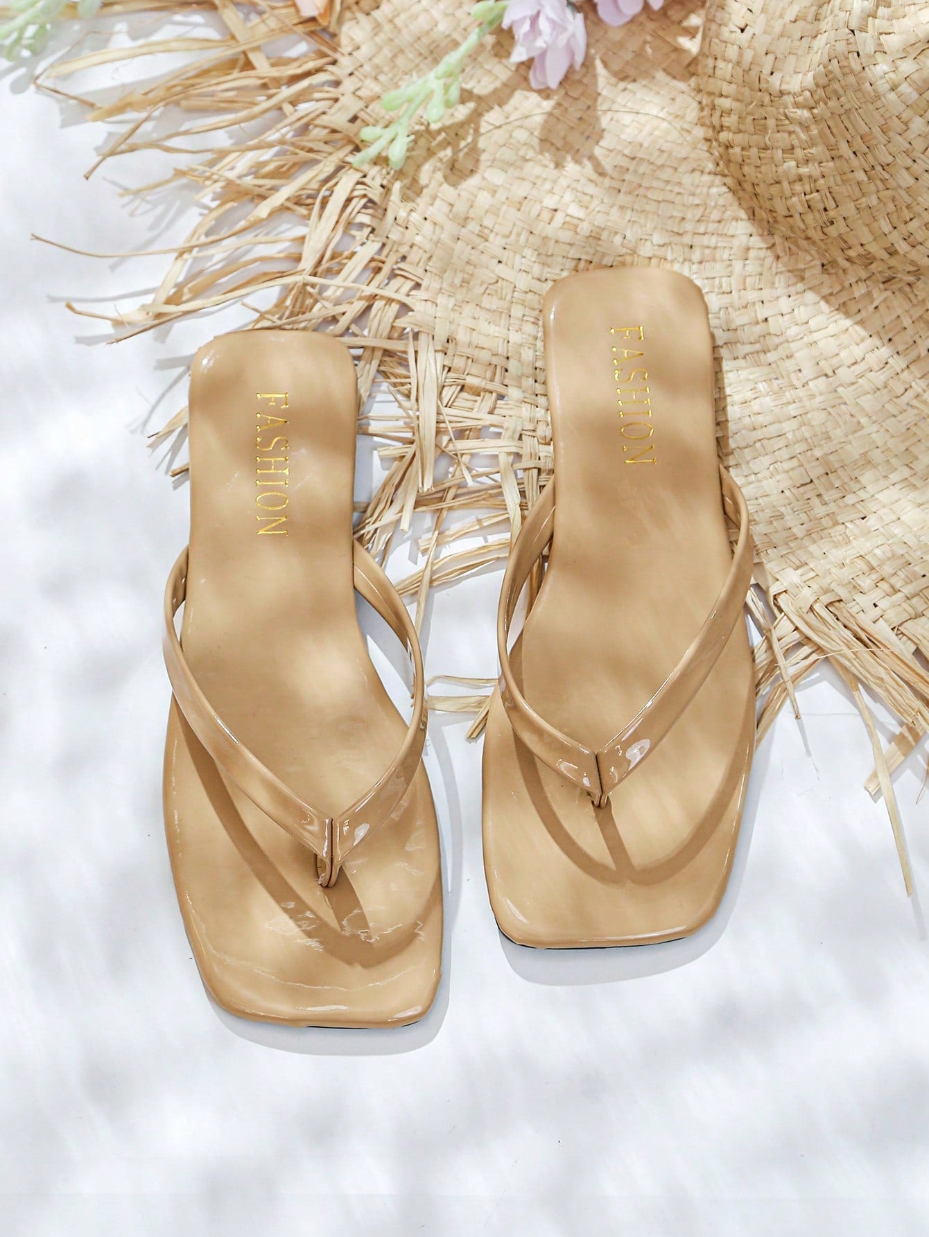 Women's square toe flip flop flat sandals featuring a toe-post design and criss cross strap detail, glossy fashion slides for beach, home, outing, and party wear.