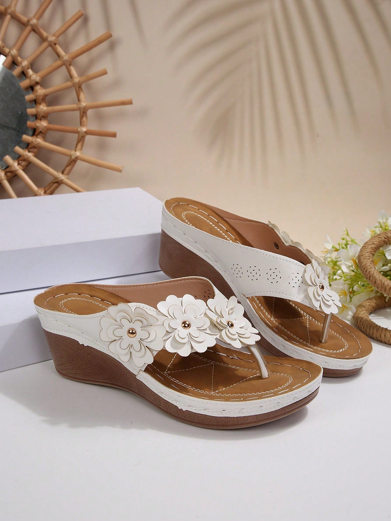 Women's gold platform flip flop wedge sandals with toe post and textured flower detail, slip-on vacation slide style with mid heel.