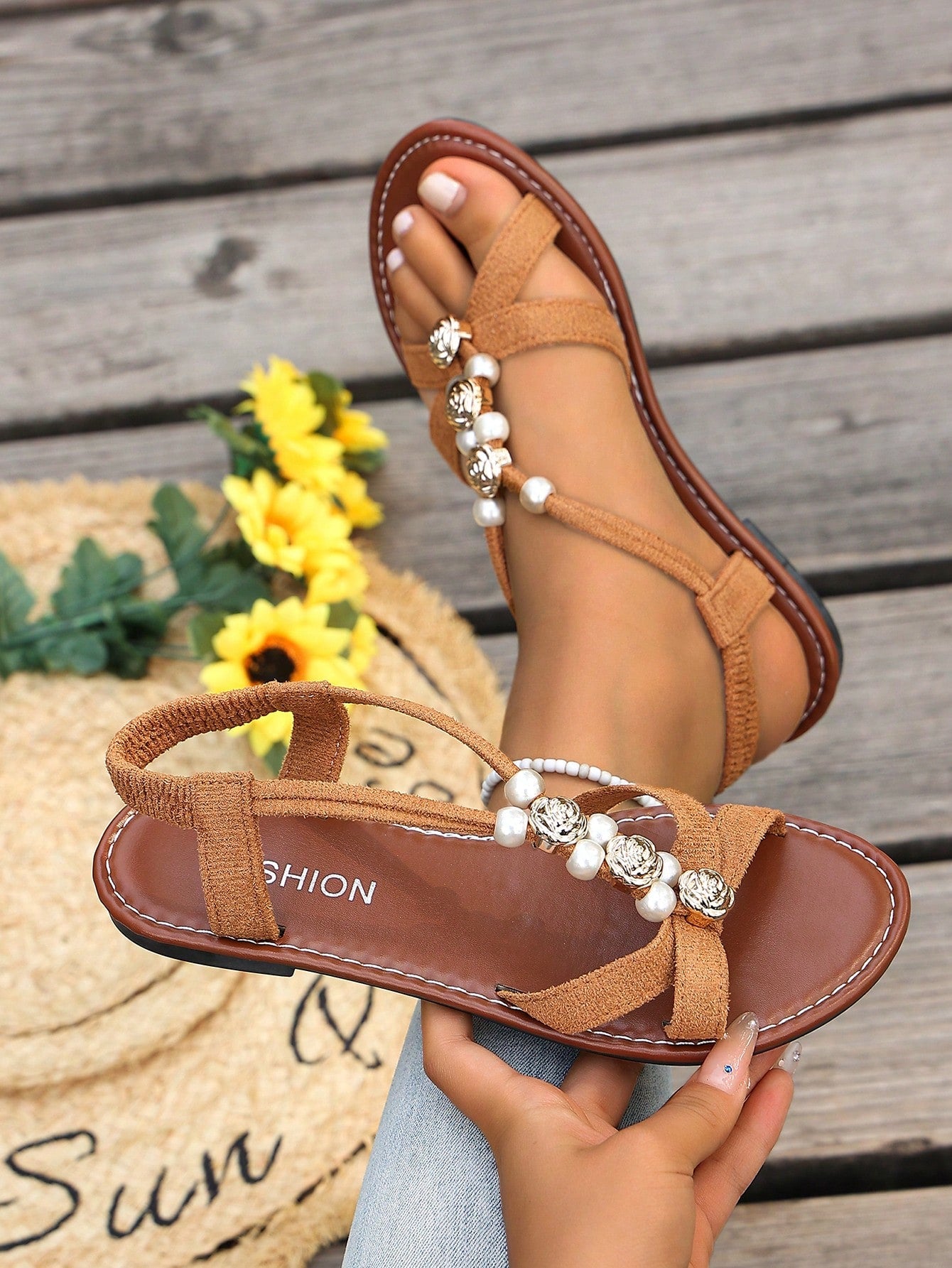 Women's beaded open-toe thong flat sandals in slip-on style for outdoor and beach casual wear.