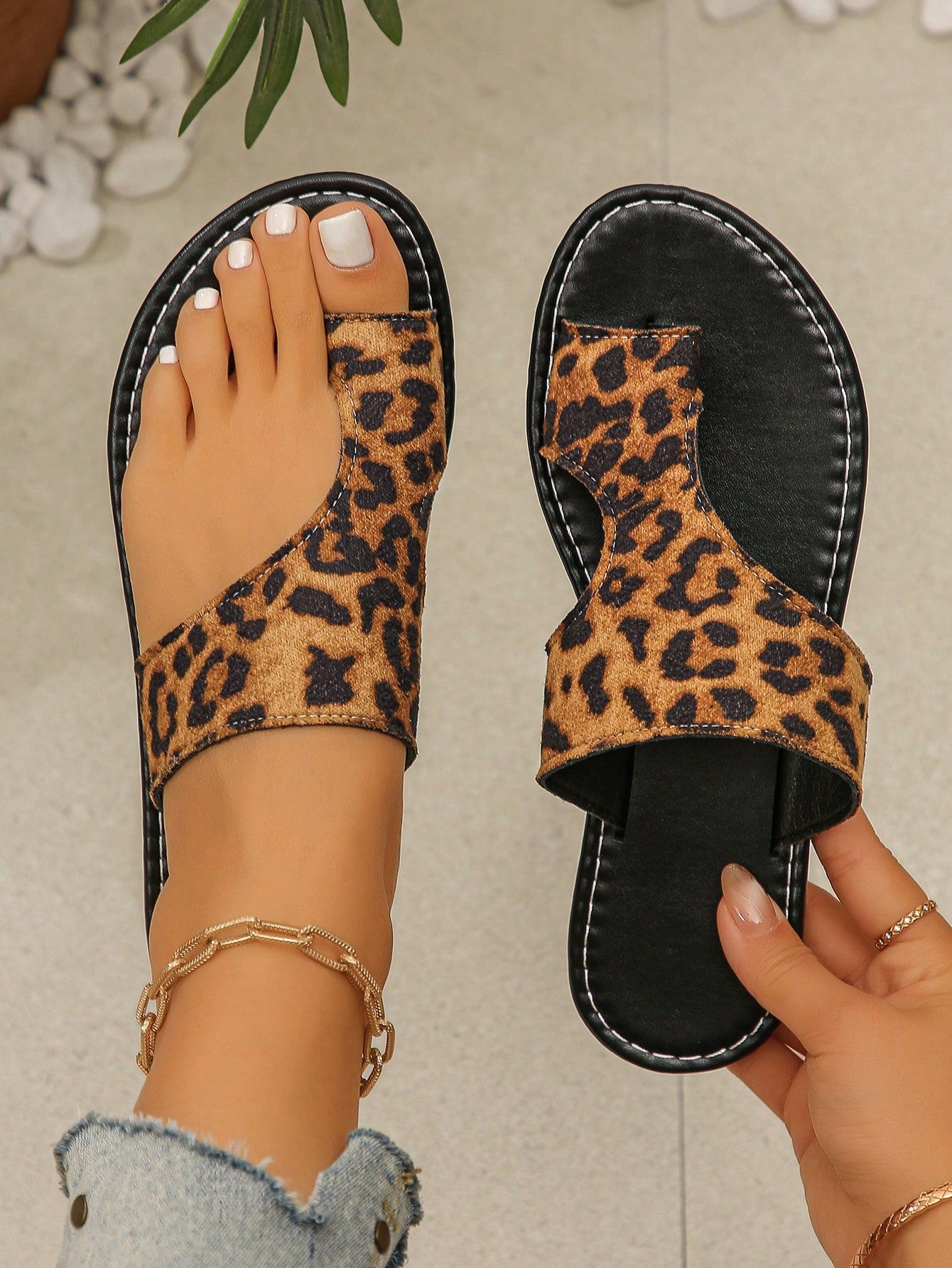 Women's flat slide sandals with camouflage print, open toe toe-post design, and hollow-out detailing in a casual summer style.