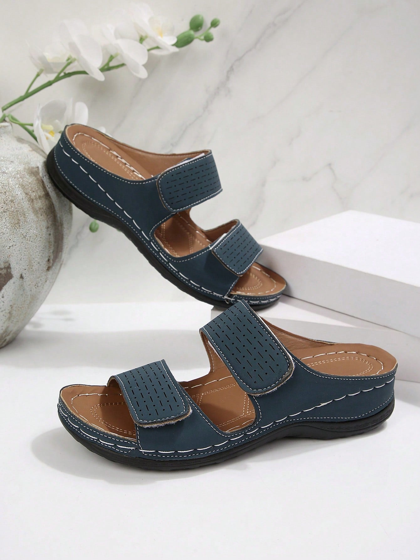 Women's color block platform flat sandals with open toe, criss-cross straps, and hook-loop closure, featuring a low heel thick sole design for casual vacation wear.