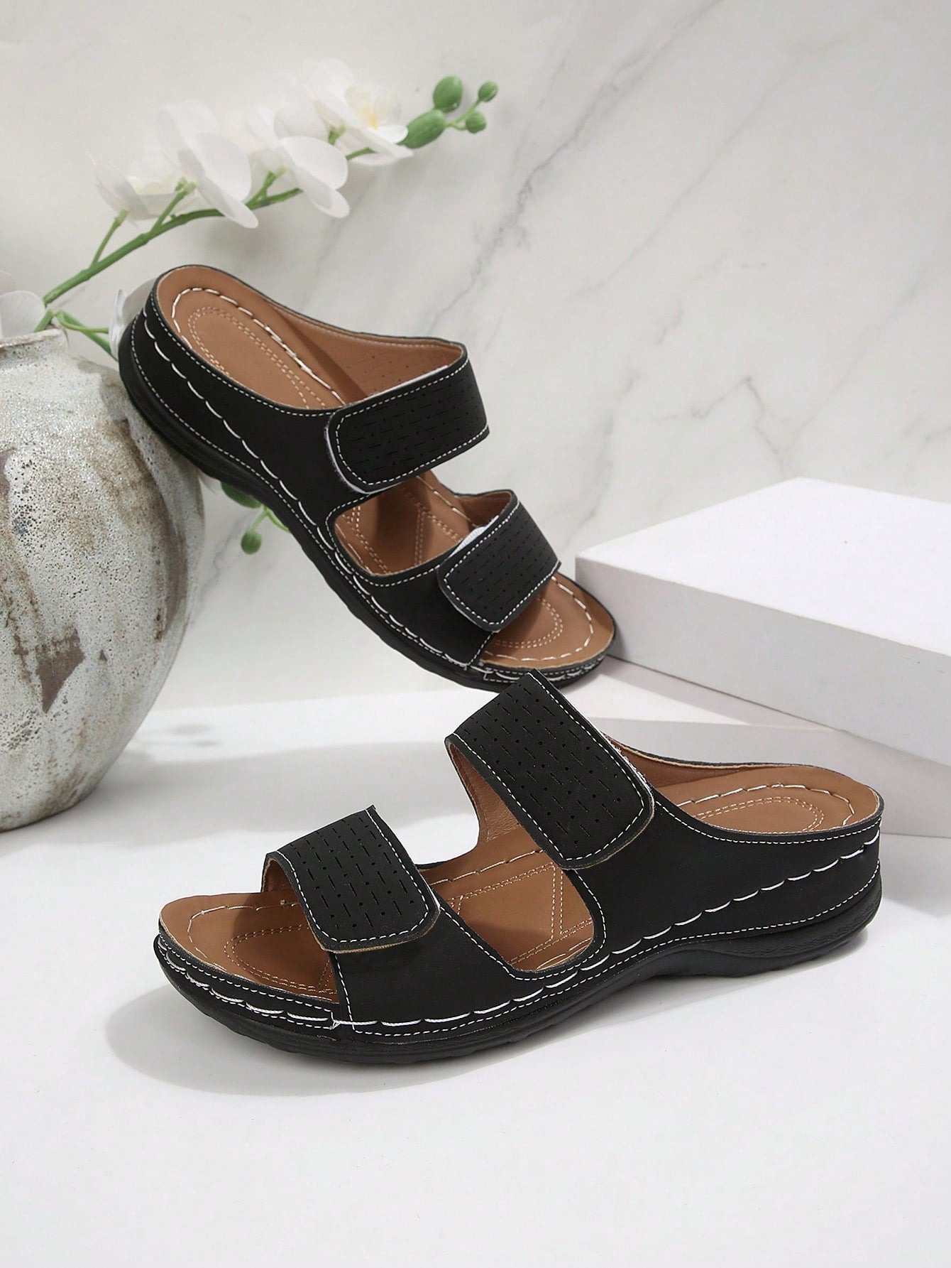 Women's color block platform flat sandals with open toe, criss-cross straps, and hook-loop closure, featuring a low heel thick sole design for casual vacation wear.