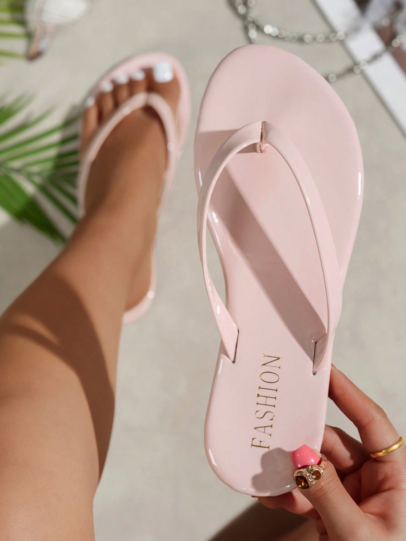 Women's shiny flat flip flop slide sandals with criss cross straps and round toe, suitable for beach, travel, home, and casual outings.