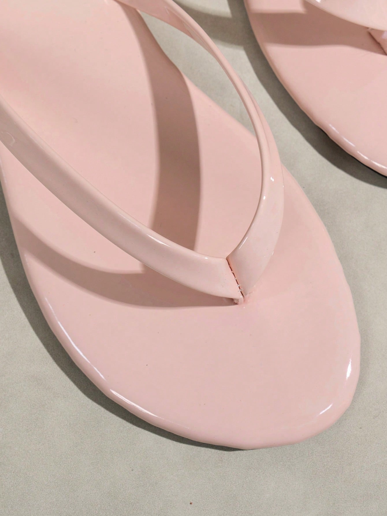 Women's shiny flat flip flop slide sandals with criss cross straps and round toe, suitable for beach, travel, home, and casual outings.