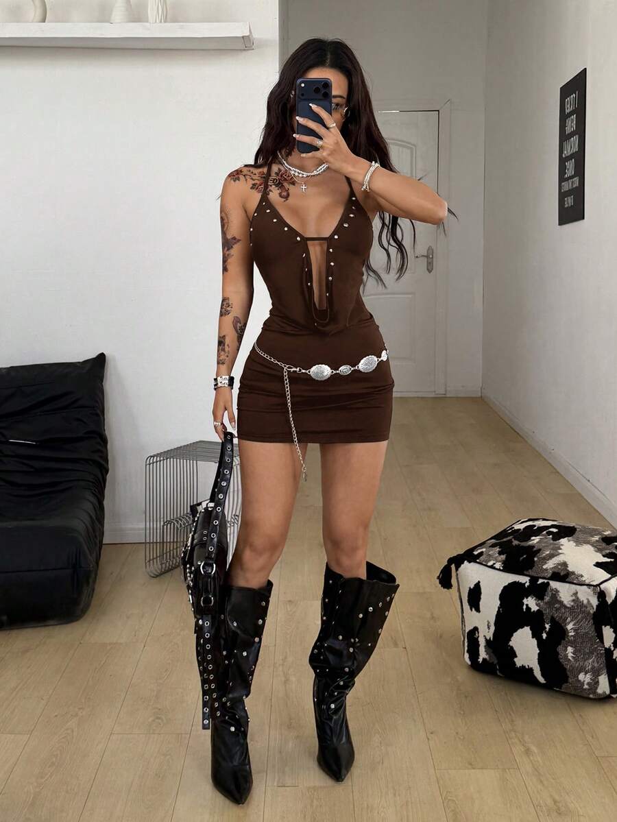 Women's sleeveless halter cowl neck mini bodycon dress with backless knot detail and grommet eyelet accents