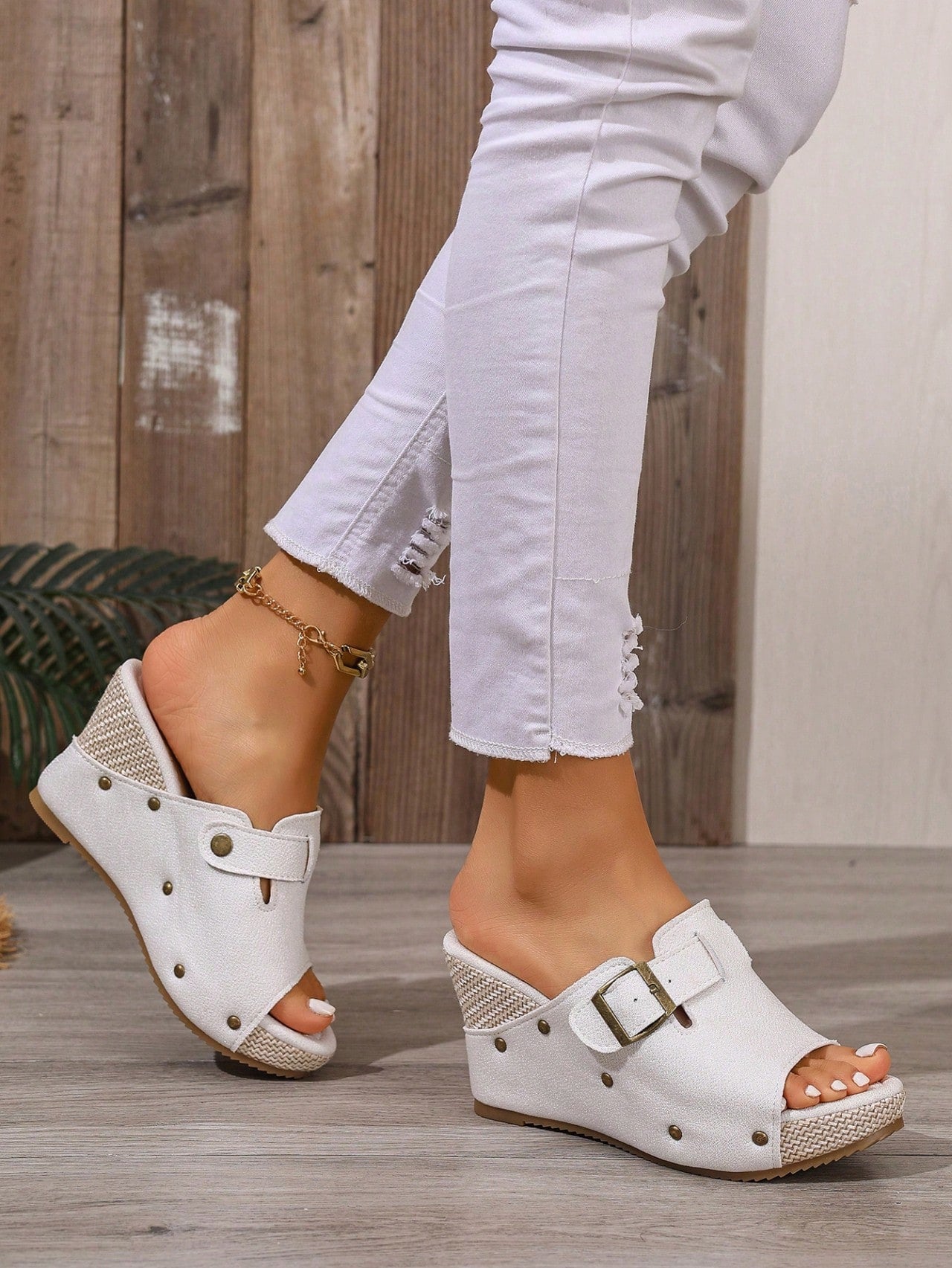 Women's open-toe slip-on platform sandals with a chunky T-strap and buckle detail, mid heel, and PU leather upper.