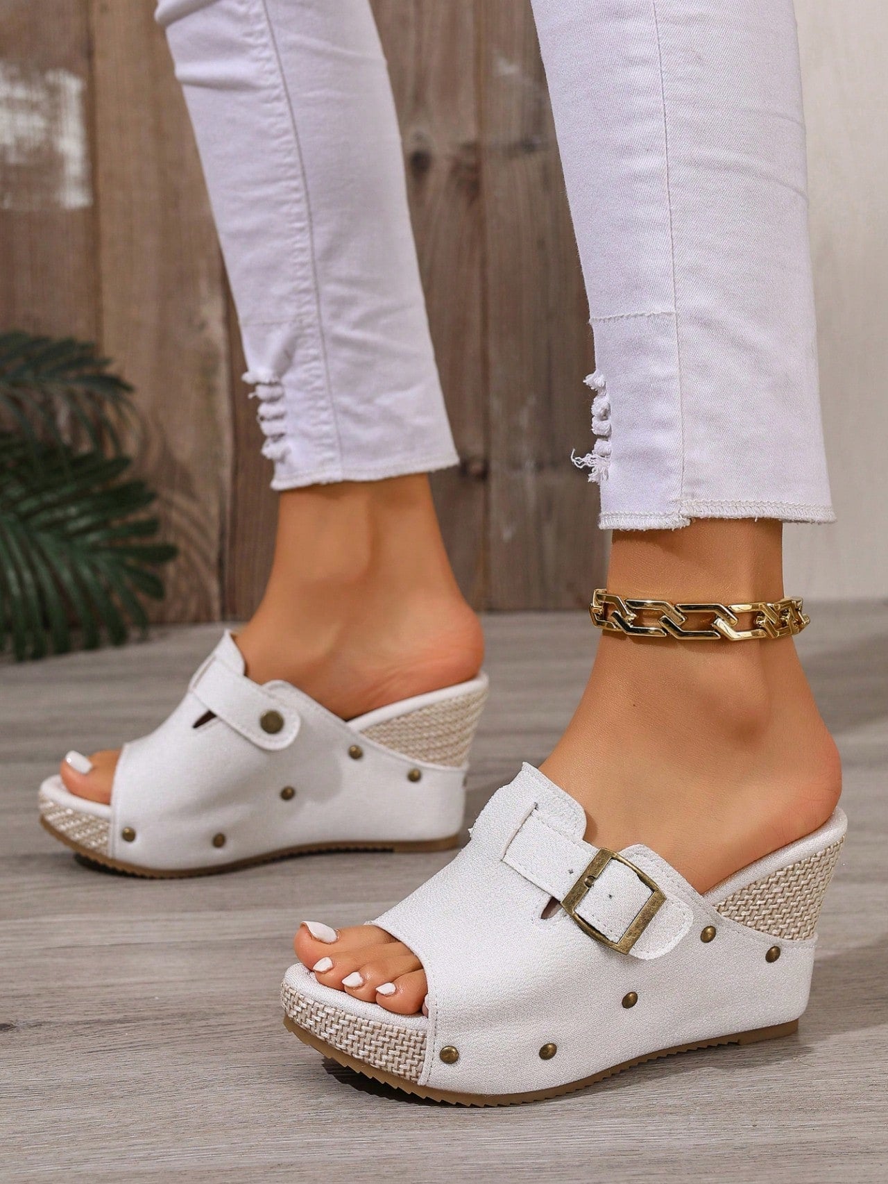 Women's open-toe slip-on platform sandals with a chunky T-strap and buckle detail, mid heel, and PU leather upper.