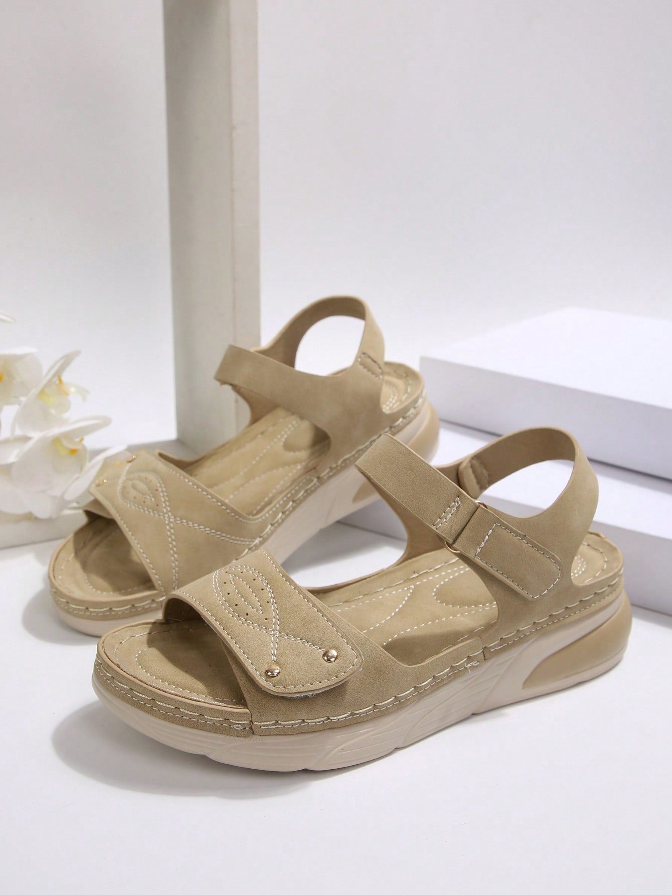 Women's plus size platform wedge sandals with hook-and-loop closure, open toe, ankle strap, and cut-out detailing in a casual beach style.