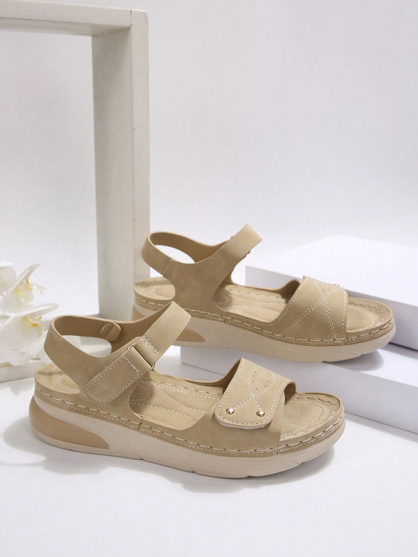 Women's plus size platform wedge sandals with hook-and-loop closure, open toe, ankle strap, and cut-out detailing in a casual beach style.