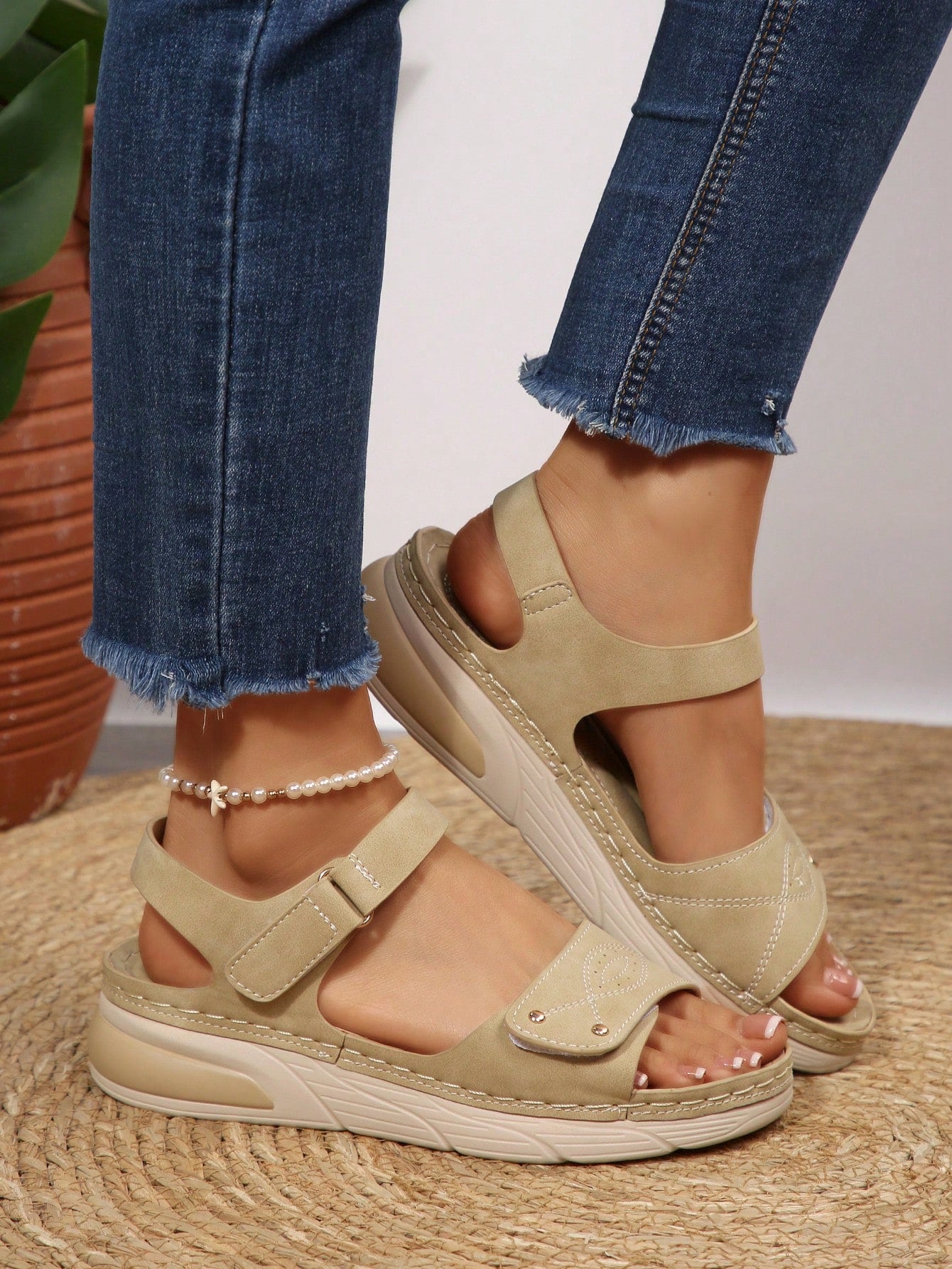 Women's plus size platform wedge sandals with hook-and-loop closure, open toe, ankle strap, and cut-out detailing in a casual beach style.