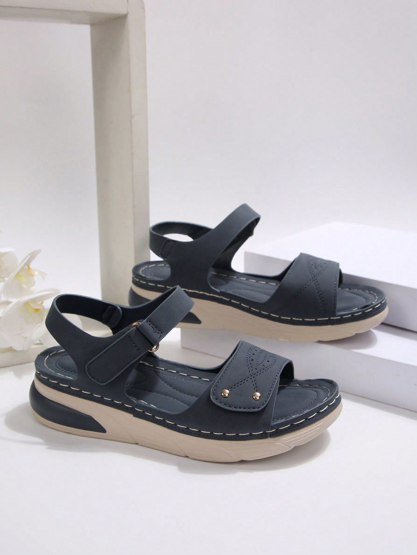 Women's plus size platform wedge sandals with hook-and-loop closure, open toe, ankle strap, and cut-out detailing in a casual beach style.