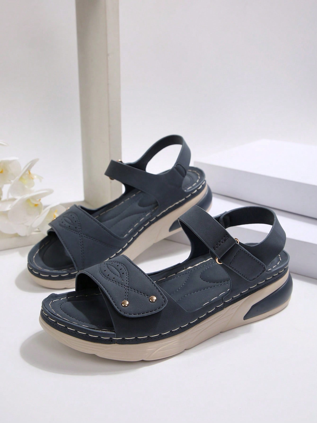 Women's plus size platform wedge sandals with hook-and-loop closure, open toe, ankle strap, and cut-out detailing in a casual beach style.