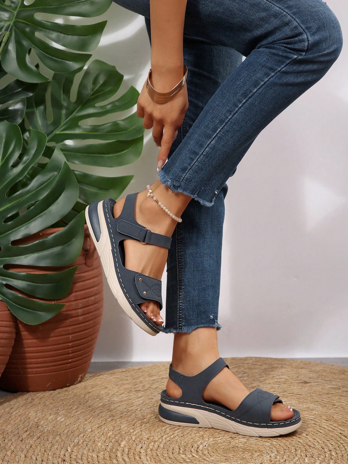 Women's plus size platform wedge sandals with hook-and-loop closure, open toe, ankle strap, and cut-out detailing in a casual beach style.