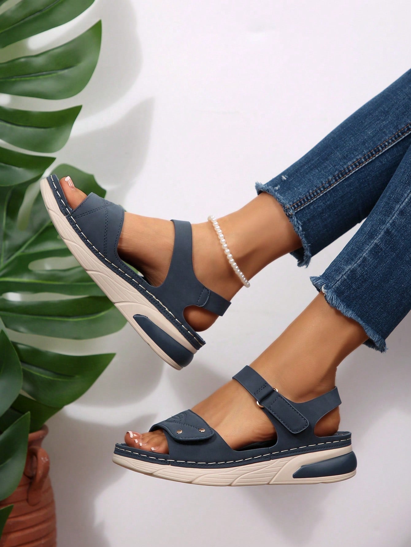 Women's plus size platform wedge sandals with hook-and-loop closure, open toe, ankle strap, and cut-out detailing in a casual beach style.