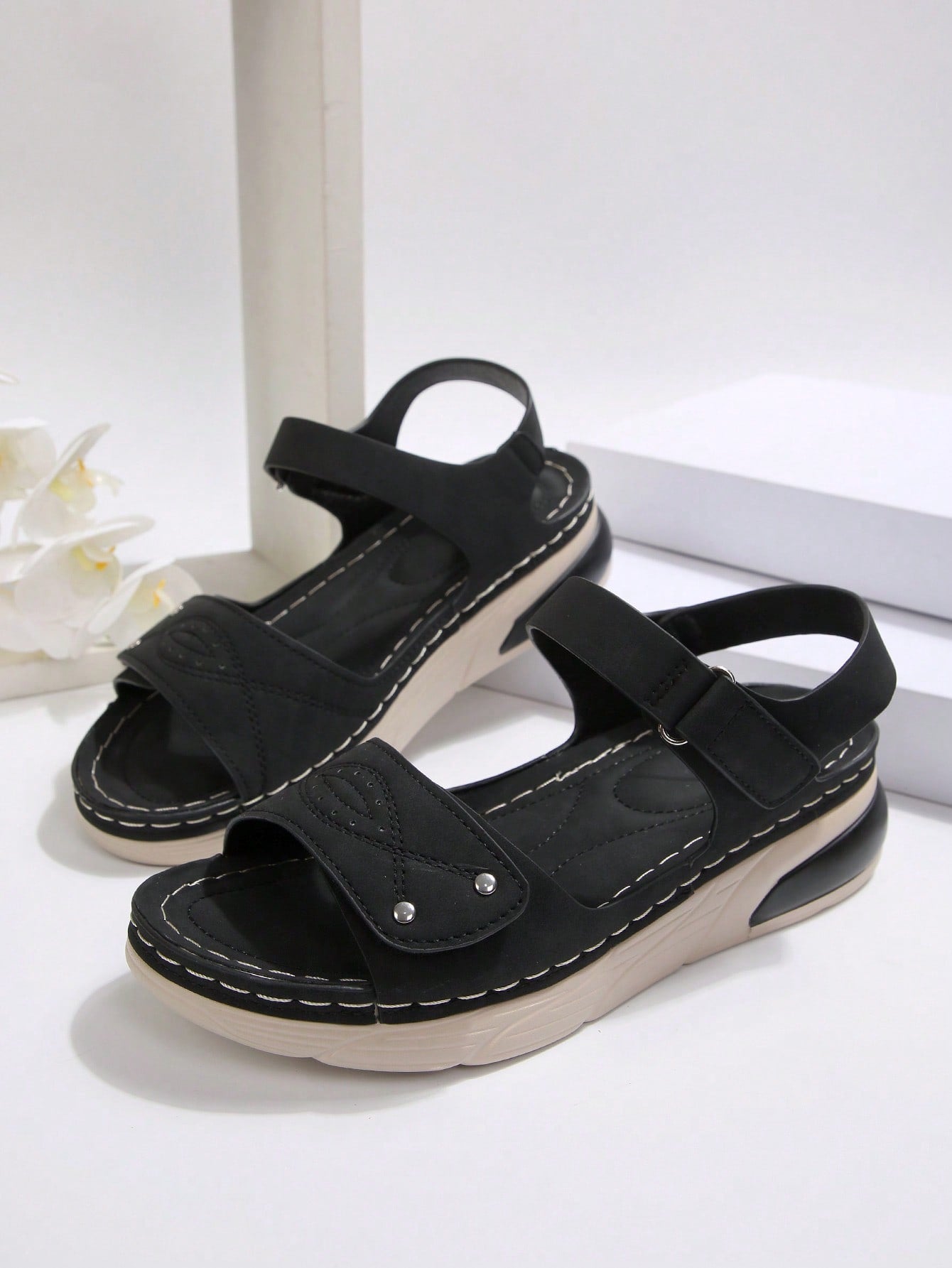 Women's plus size platform wedge sandals with hook-and-loop closure, open toe, ankle strap, and cut-out detailing in a casual beach style.