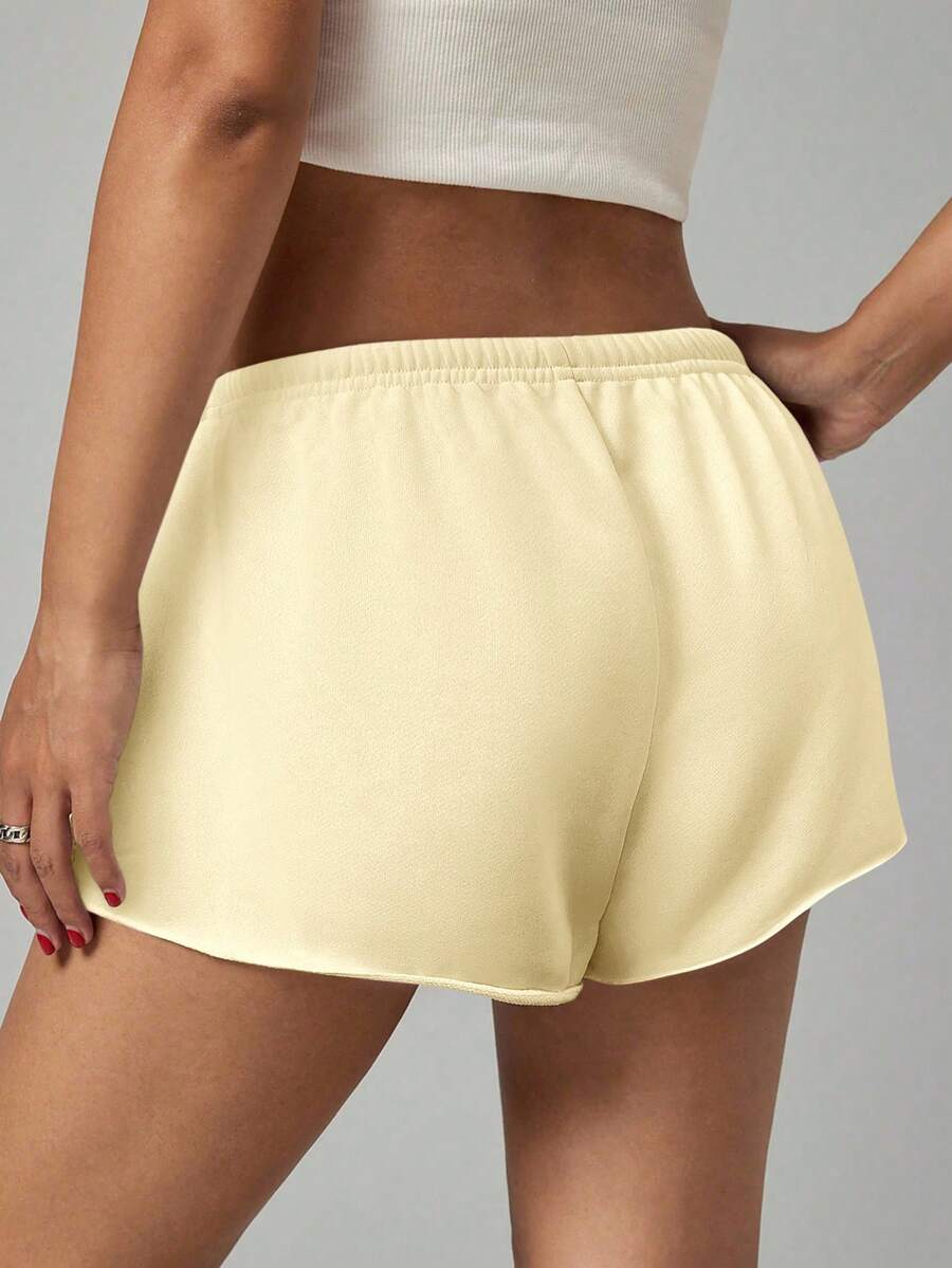 Petite women's burgundy casual track shorts with drawstring waist, raw hem, loose fit, and mini length