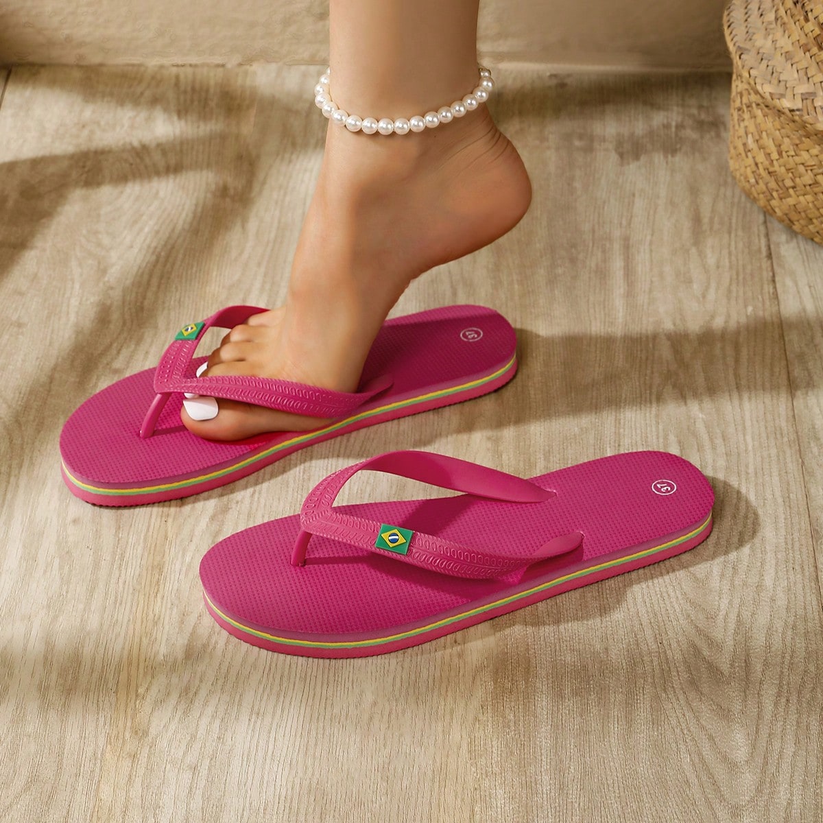 Women's flat slip-on beach flip flops with a round-toe shape and casual sandal style for indoor and outdoor use.