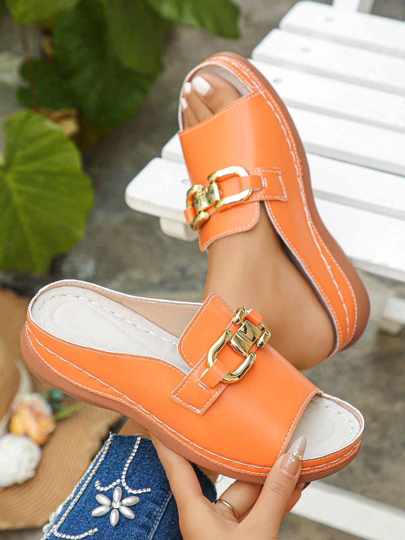 Women's bohemian wedge slide sandals with open toe, low wedge heel, slip-on design, and metal detail, available in plus sizes 36-43.