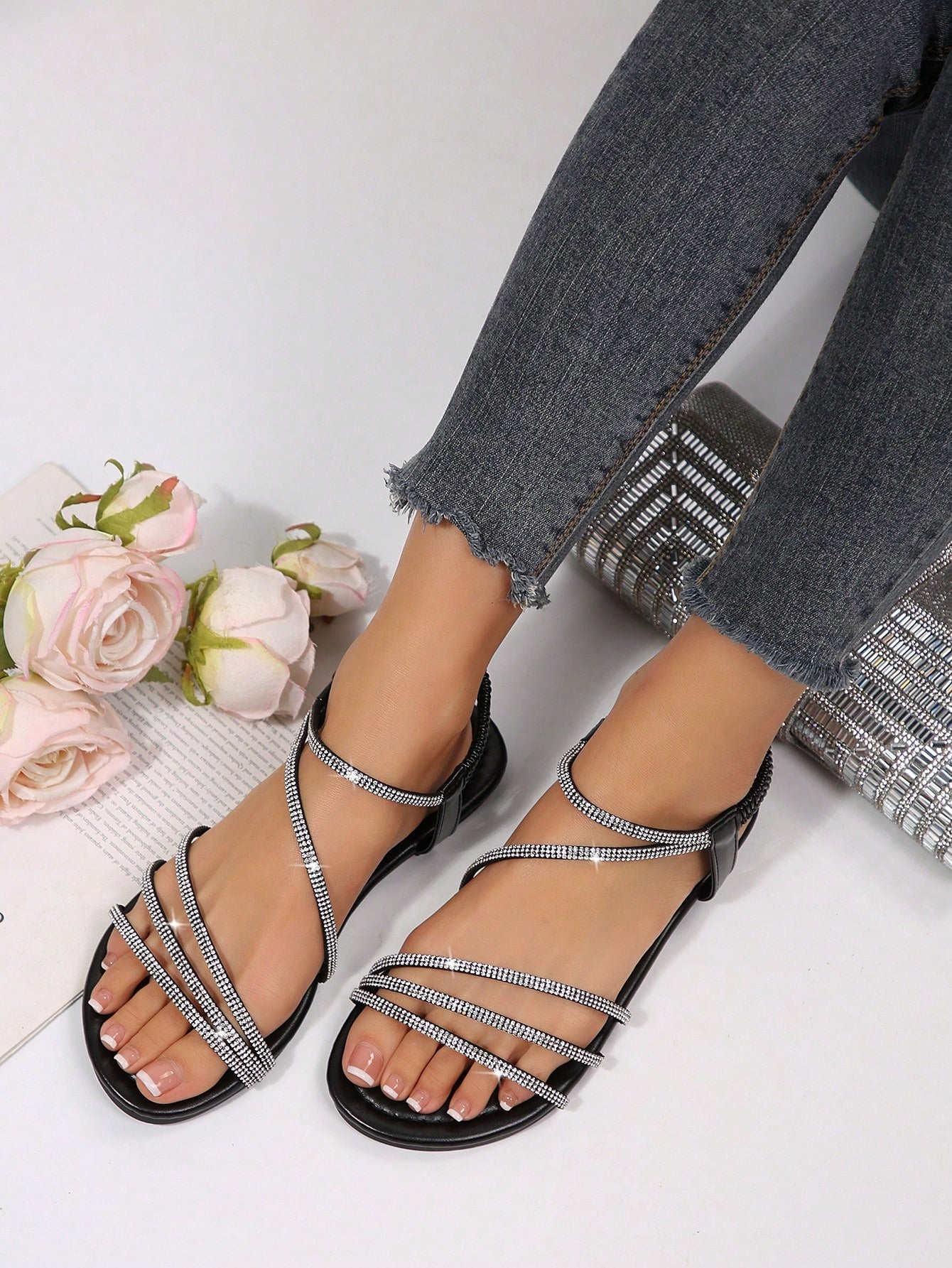 Women's flat sandals with rhinestone strap detail, elastic back, and open round toe in slide style for outdoor or beach wear.