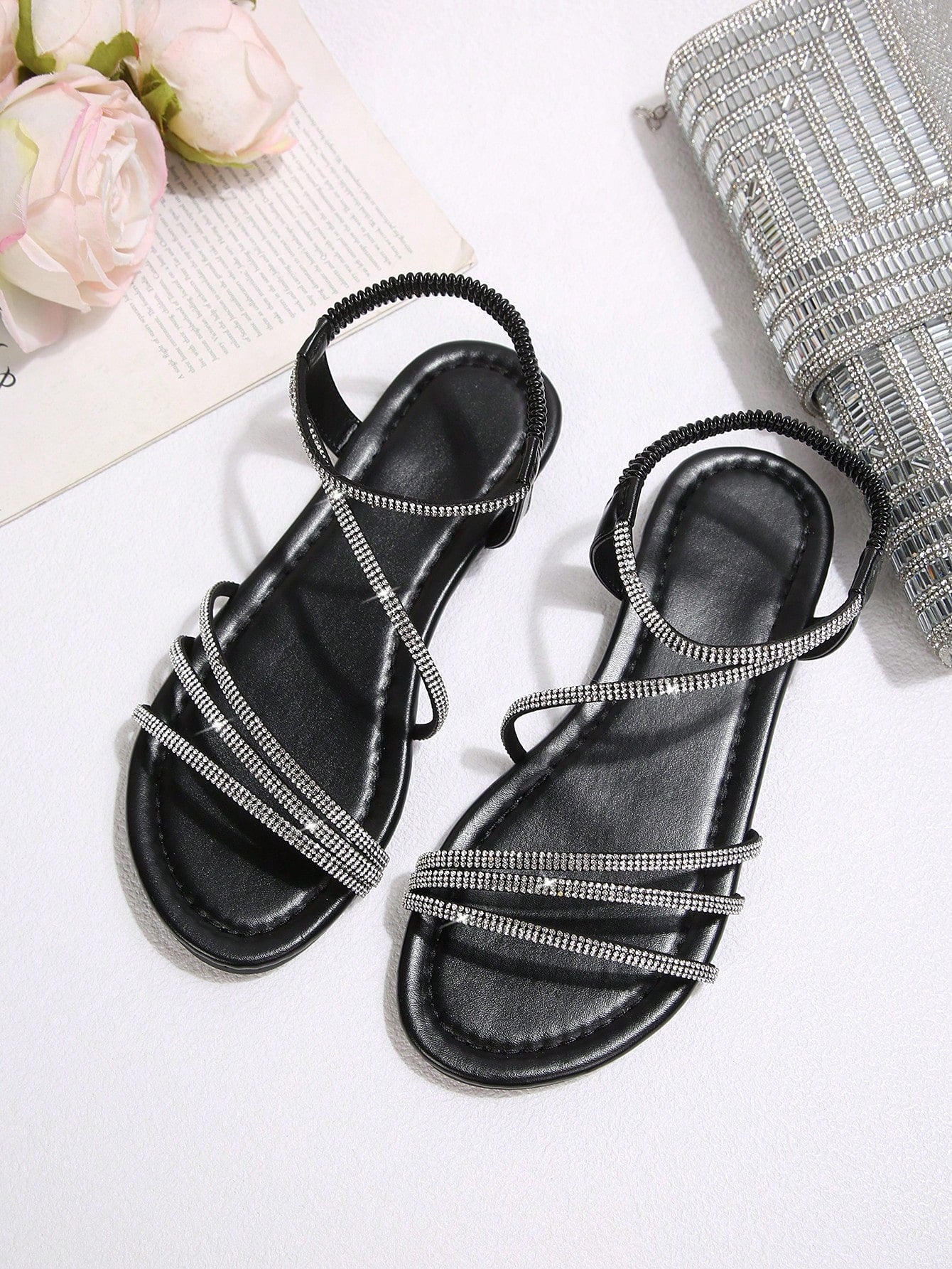 Women's flat sandals with rhinestone strap detail, elastic back, and open round toe in slide style for outdoor or beach wear.