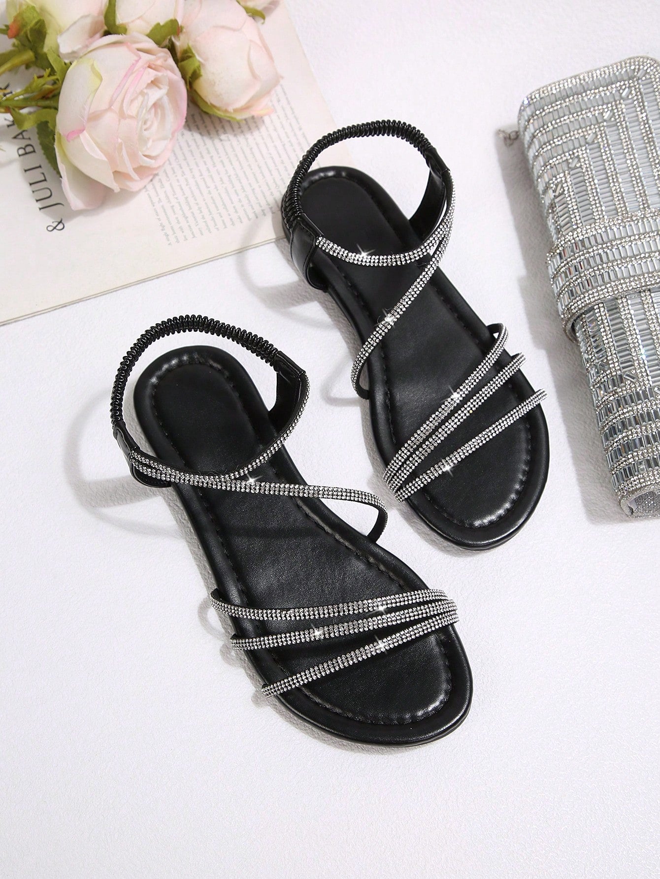 Women's flat sandals with rhinestone strap detail, elastic back, and open round toe in slide style for outdoor or beach wear.