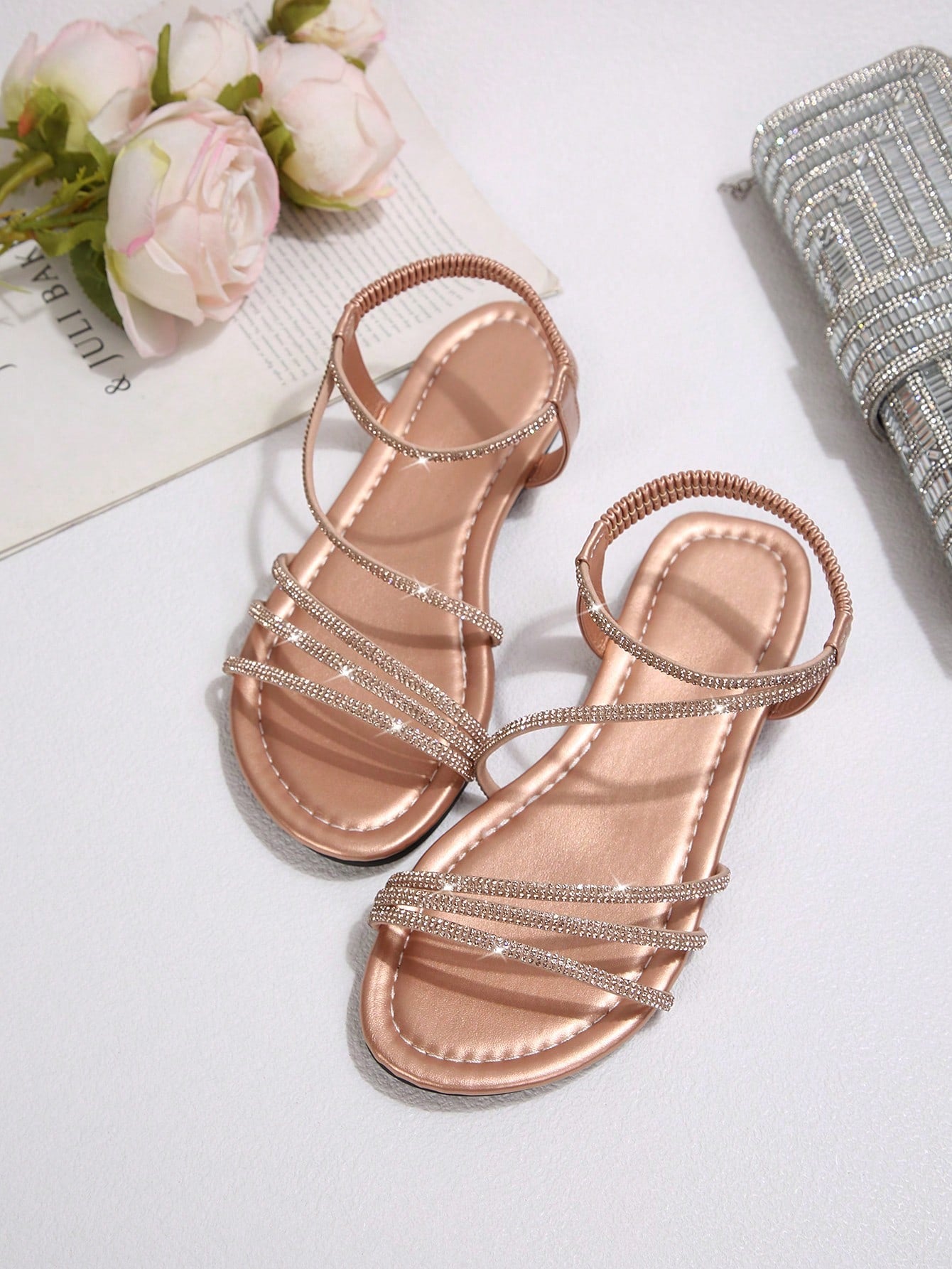 Women's flat sandals with rhinestone strap detail, elastic back, and open round toe in slide style for outdoor or beach wear.