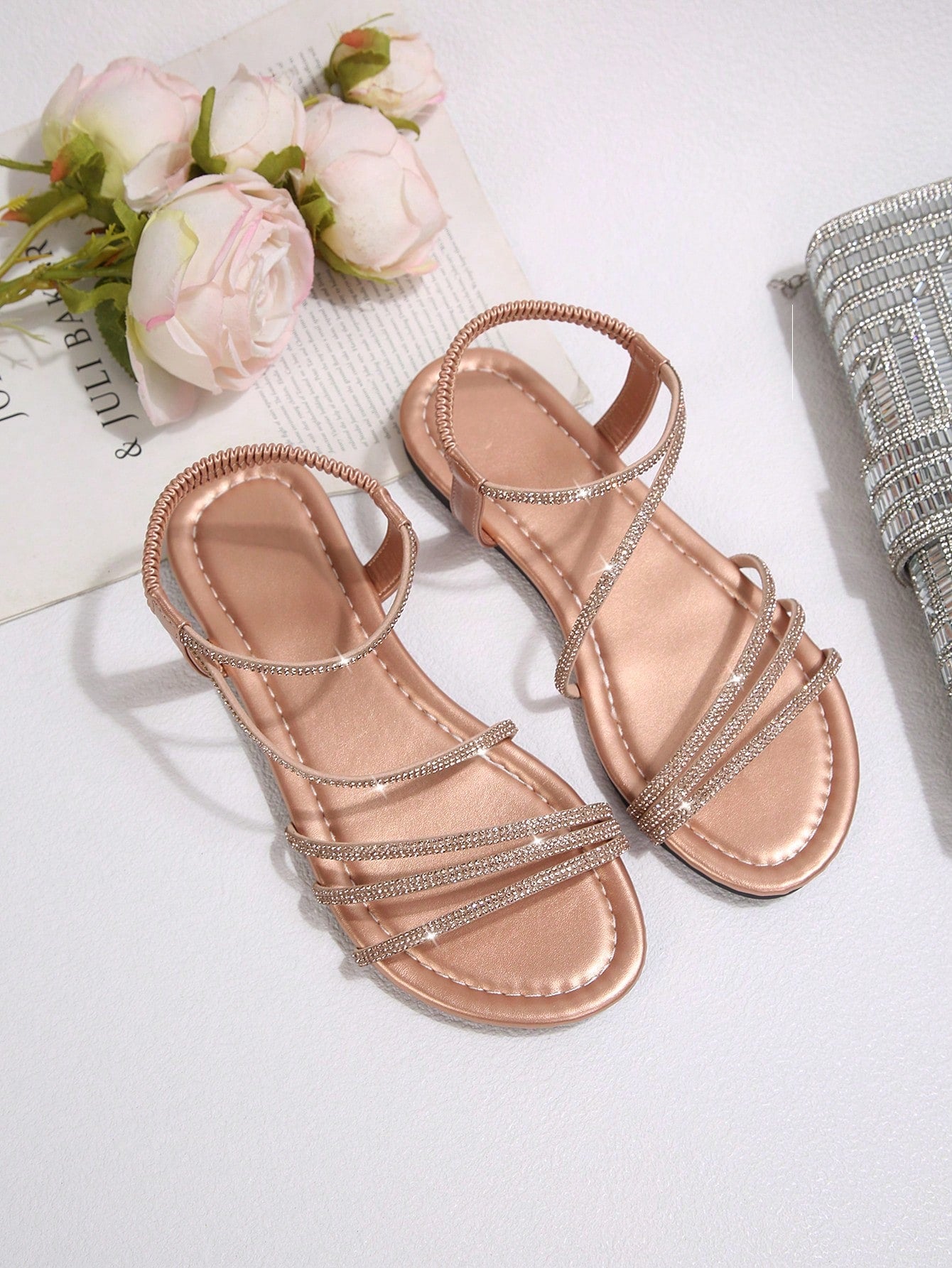 Women's flat sandals with rhinestone strap detail, elastic back, and open round toe in slide style for outdoor or beach wear.