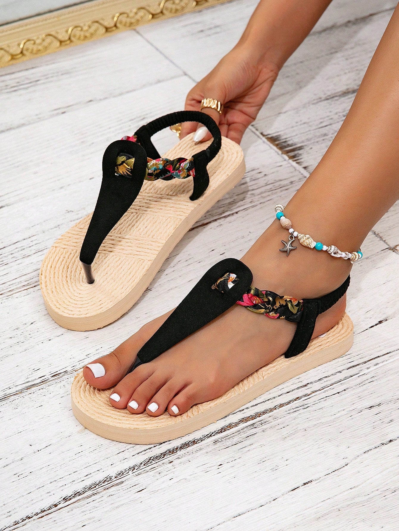 Women's flat thong flip flop sandals featuring braided knot detail and slip-on design for outdoor, beach, holiday, and travel wear.
