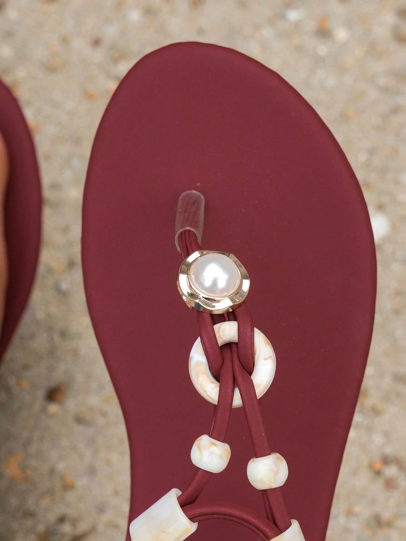 Women's beaded woven flip flop thong sandals with flat soft sole, toe-post design, and beach-style plant pattern detailing.